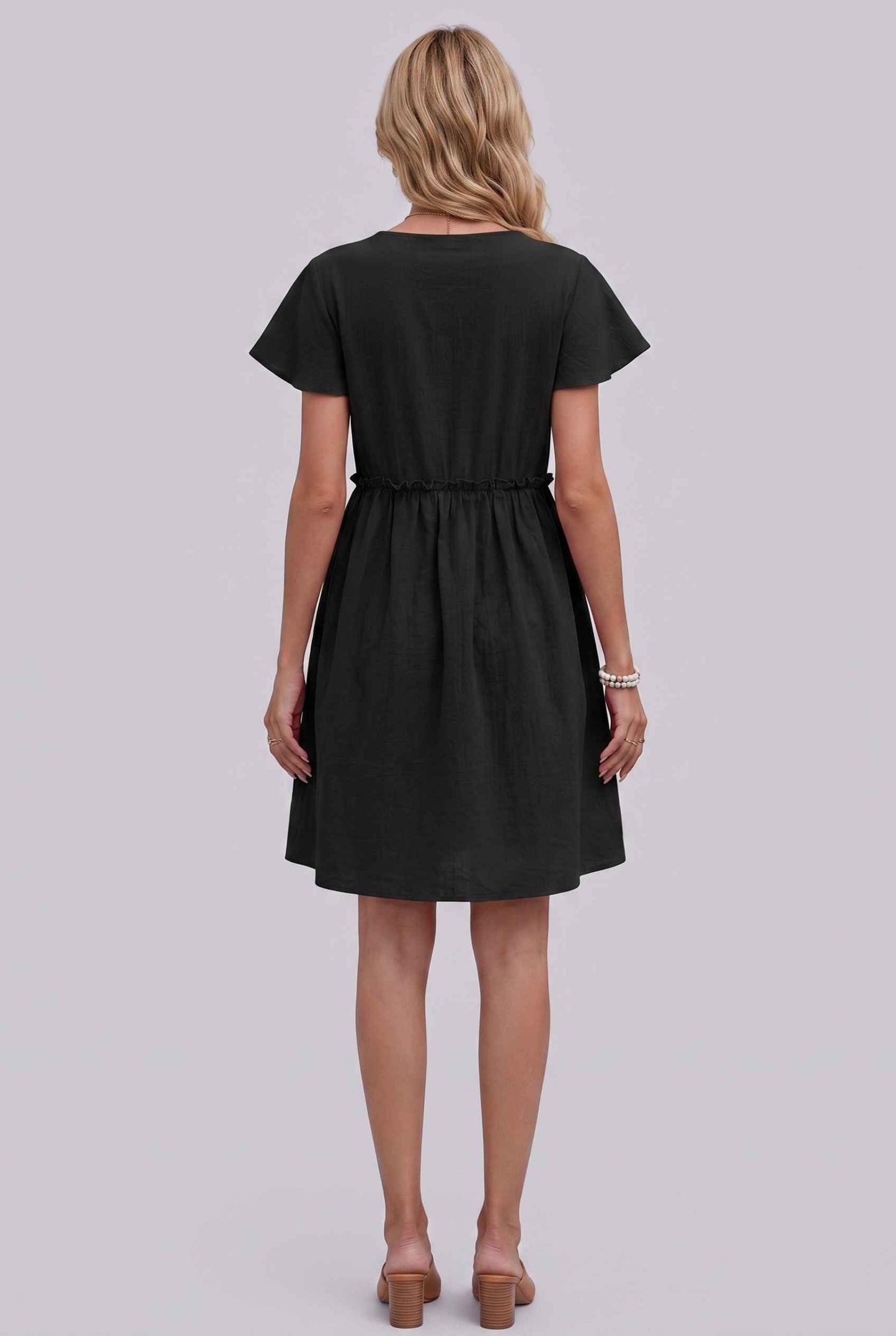 Virtual Model Wearing The Delia Buttoned Mini Flutter Sleeve Ruffled Black Dress