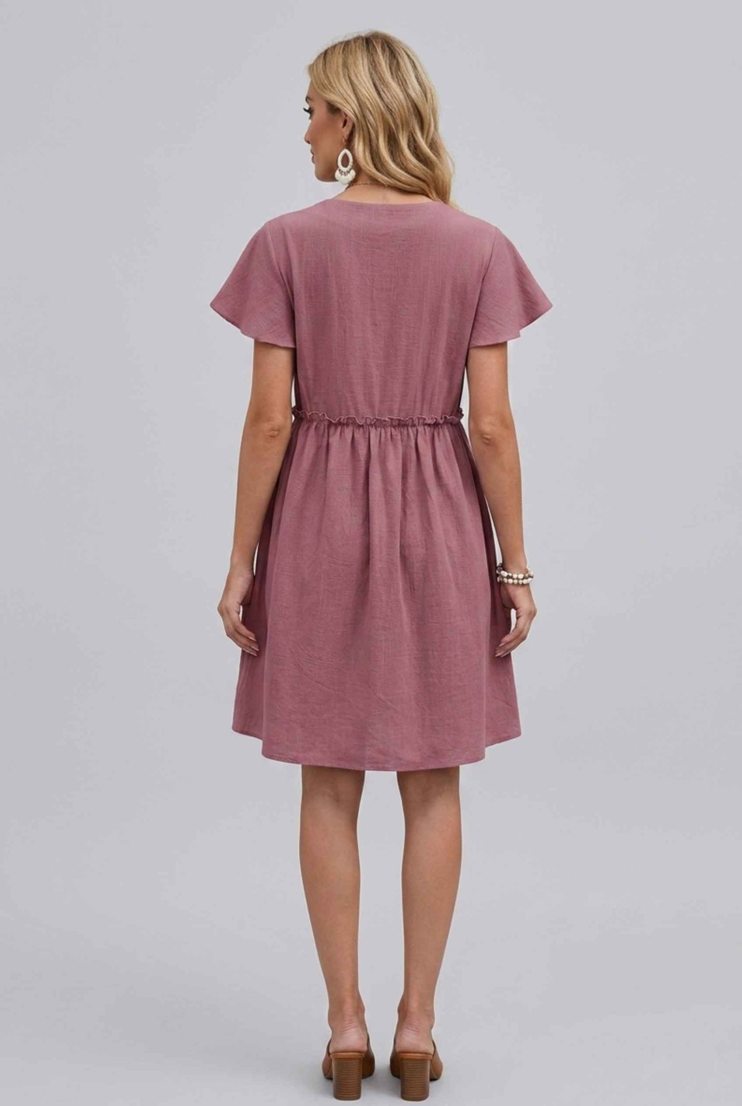 Virtual Model Wearing The Delia Buttoned Mini Flutter Sleeve Ruffled Blush Dress