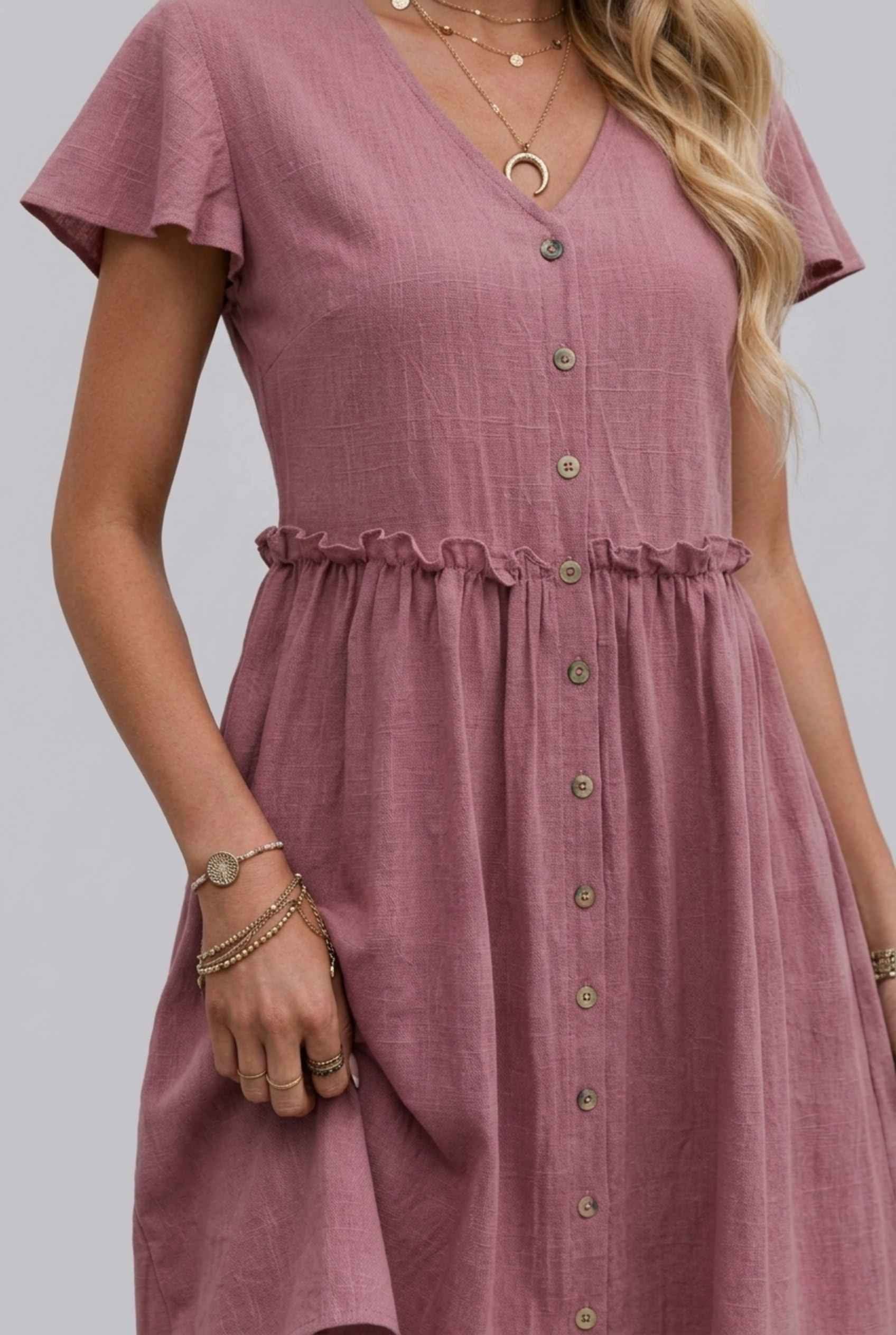 Virtual Model Wearing The Delia Buttoned Mini Flutter Sleeve Ruffled Blush Dress