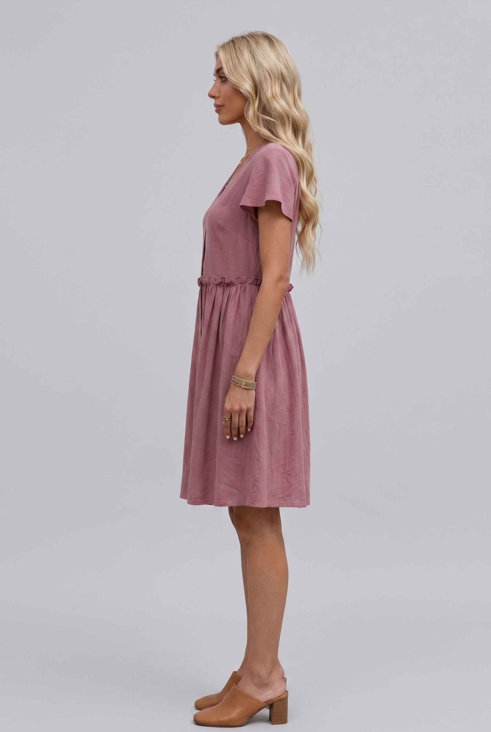 Virtual Model Wearing The Delia Buttoned Mini Flutter Sleeve Ruffled Blush Dress