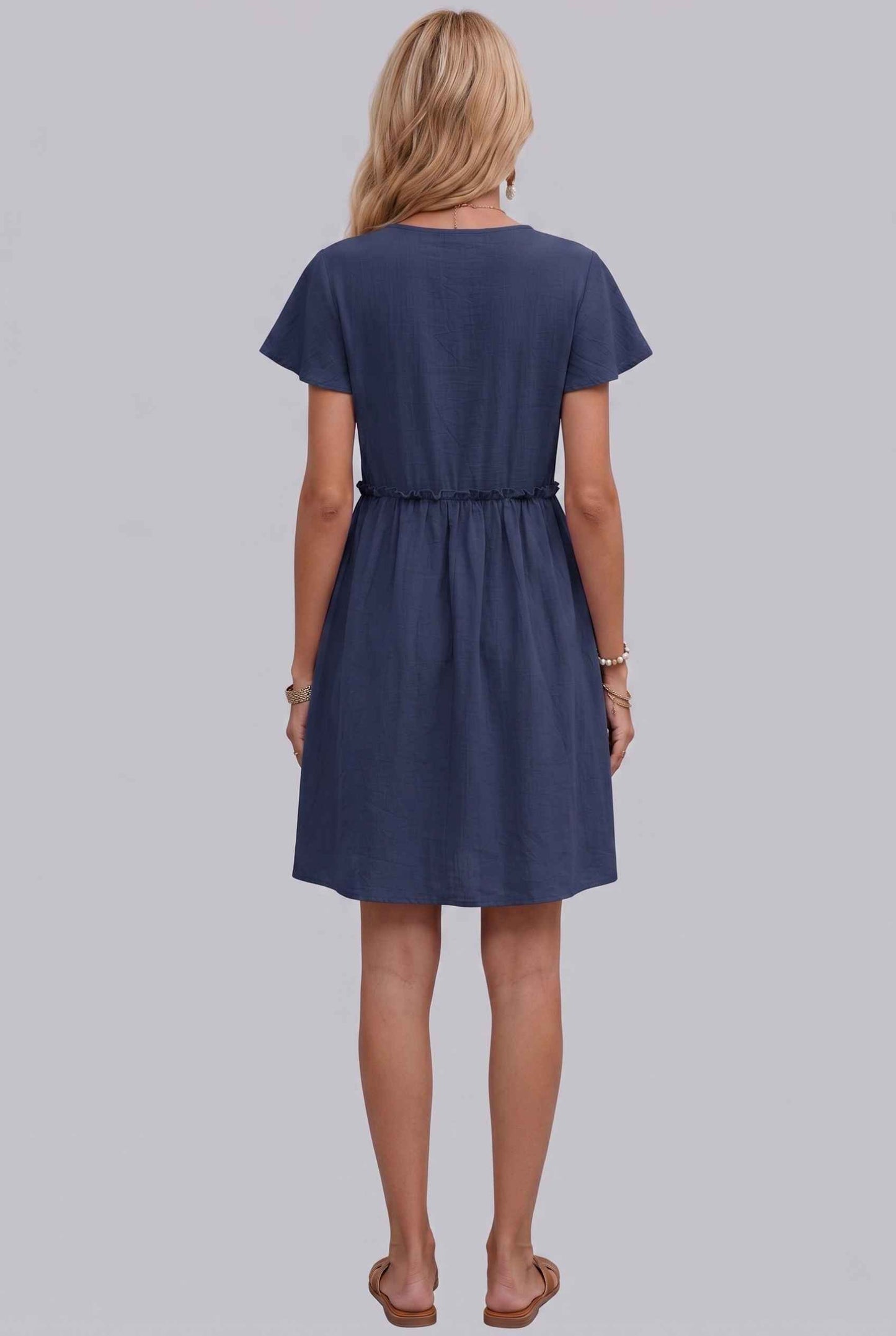 Virtual Model Wearing The Delia Buttoned Mini Flutter Sleeve Ruffled Navy Dress