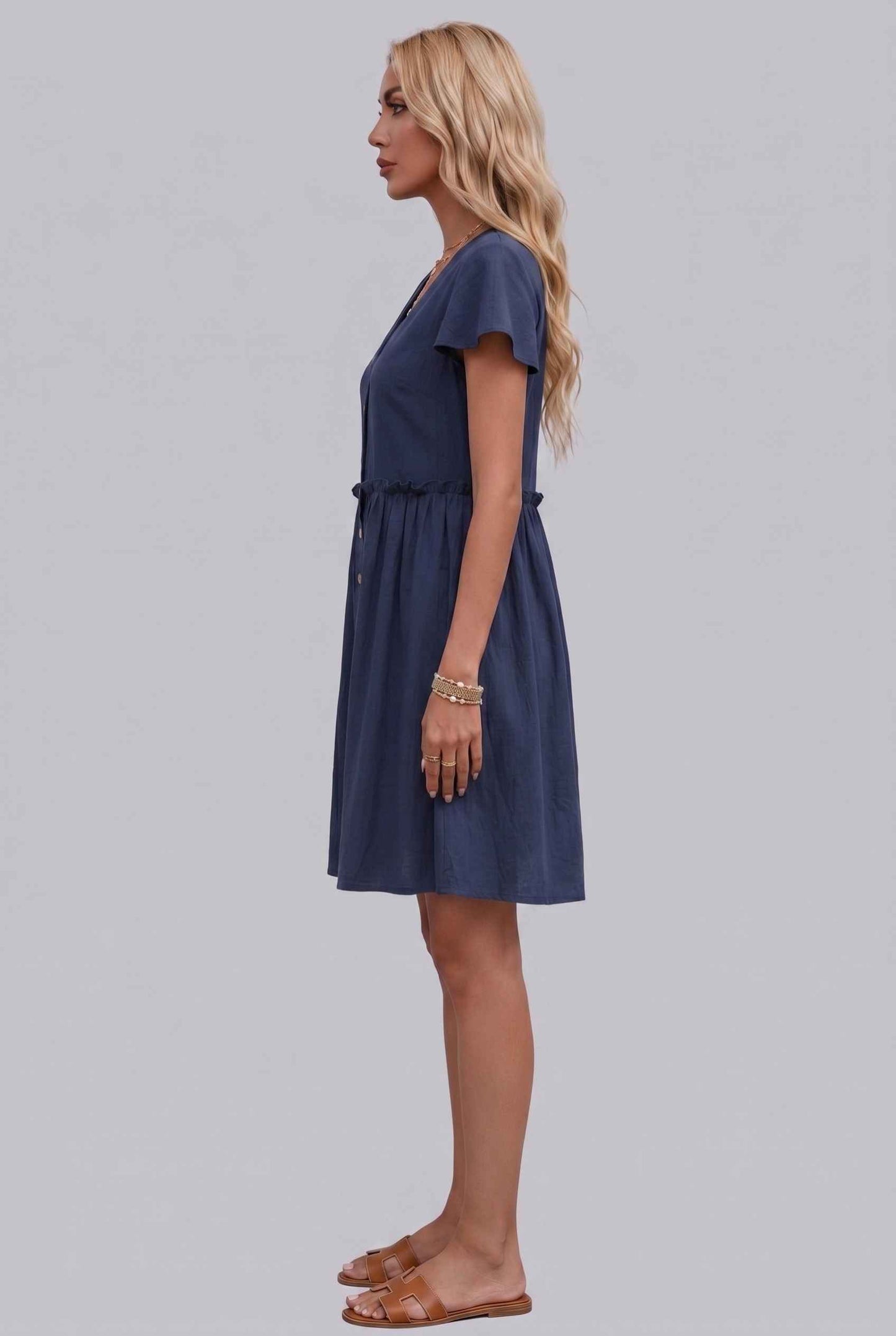 Virtual Model Wearing The Delia Buttoned Mini Flutter Sleeve Ruffled Navy Dress
