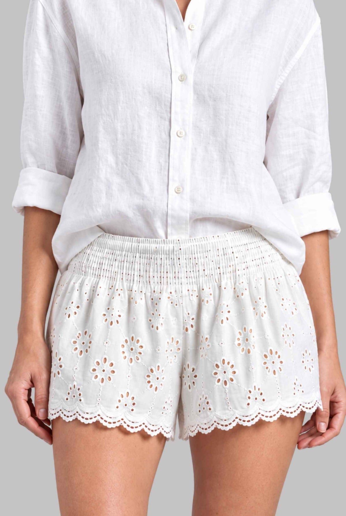 Virtual model wearing The Emiliya Eyelet Short White Eyelet Smocked Low-Rise Shorts