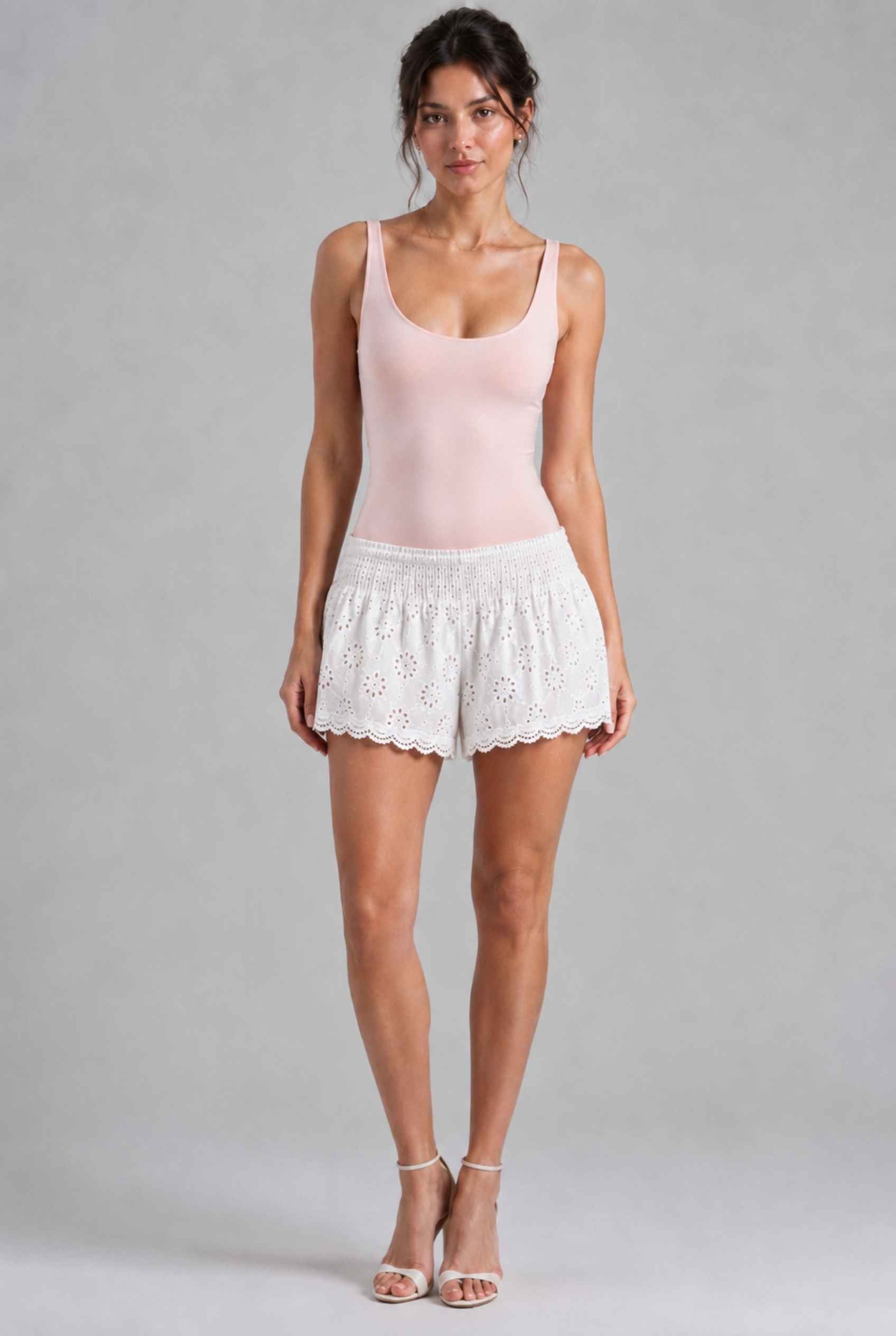 Virtual Model Wearing The Emiliya Eyelet Short White Eyelet Smocked Low-Rise Shorts