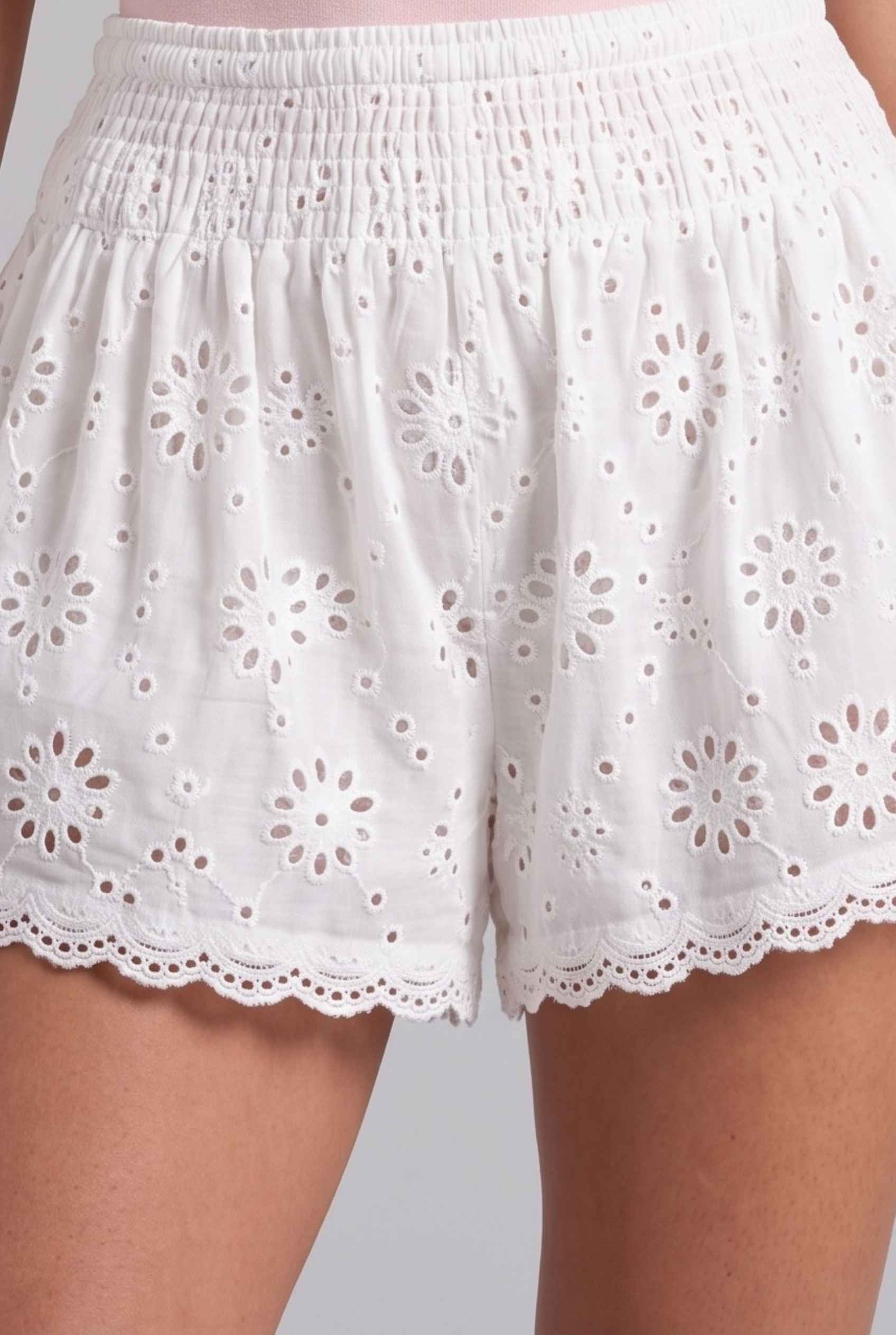 Virtual Model Wearing The Emiliya Eyelet Short White Eyelet Smocked Low-Rise Shorts