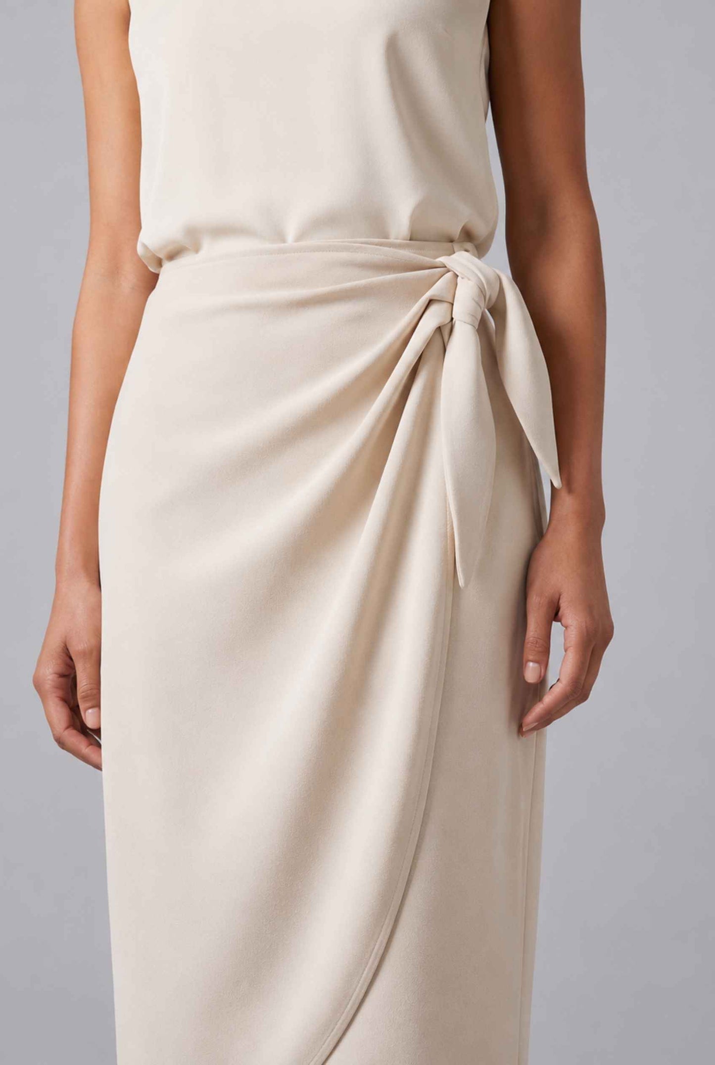 Virtual Model wearing The Esme Wrap Skirt Tie Waist Beige Midi Skirt