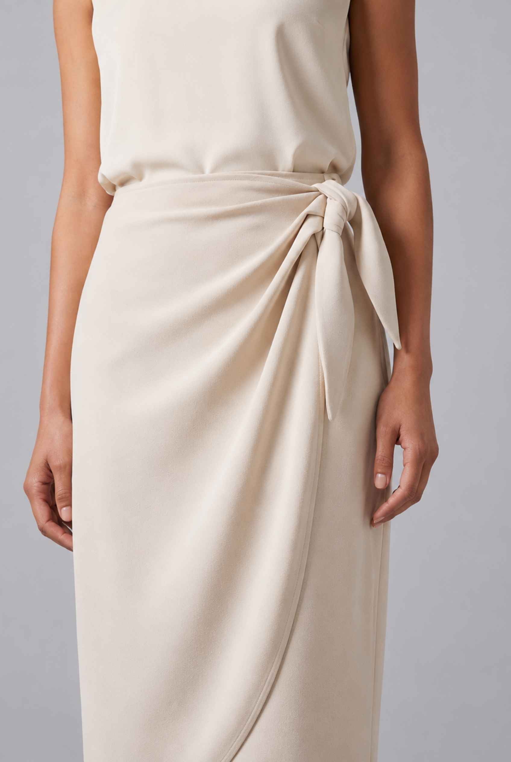 Virtual Model wearing The Esme Wrap Skirt Tie Waist Beige Midi Skirt