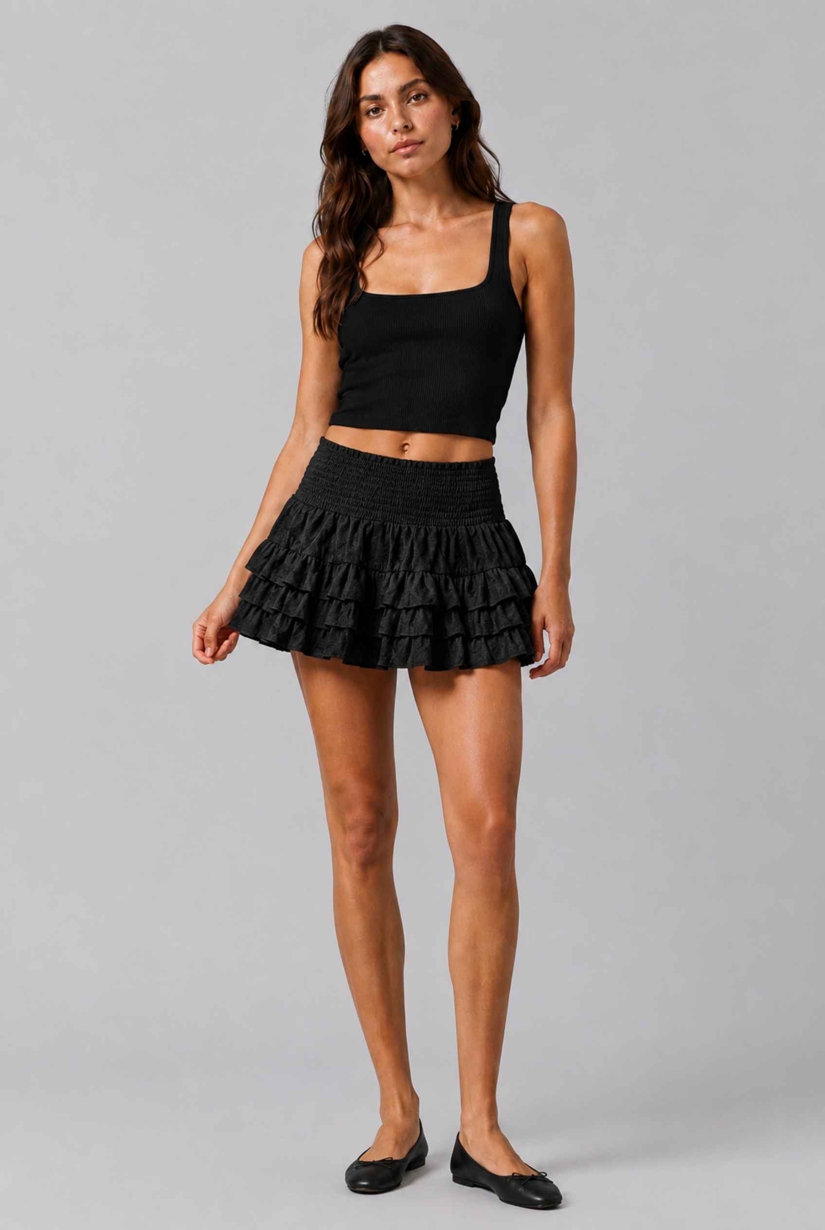 Virtual Model wearing The Etta Tiered Ruffle Mini Skirt Black Smocked Ruffle Layered Mini Skirt