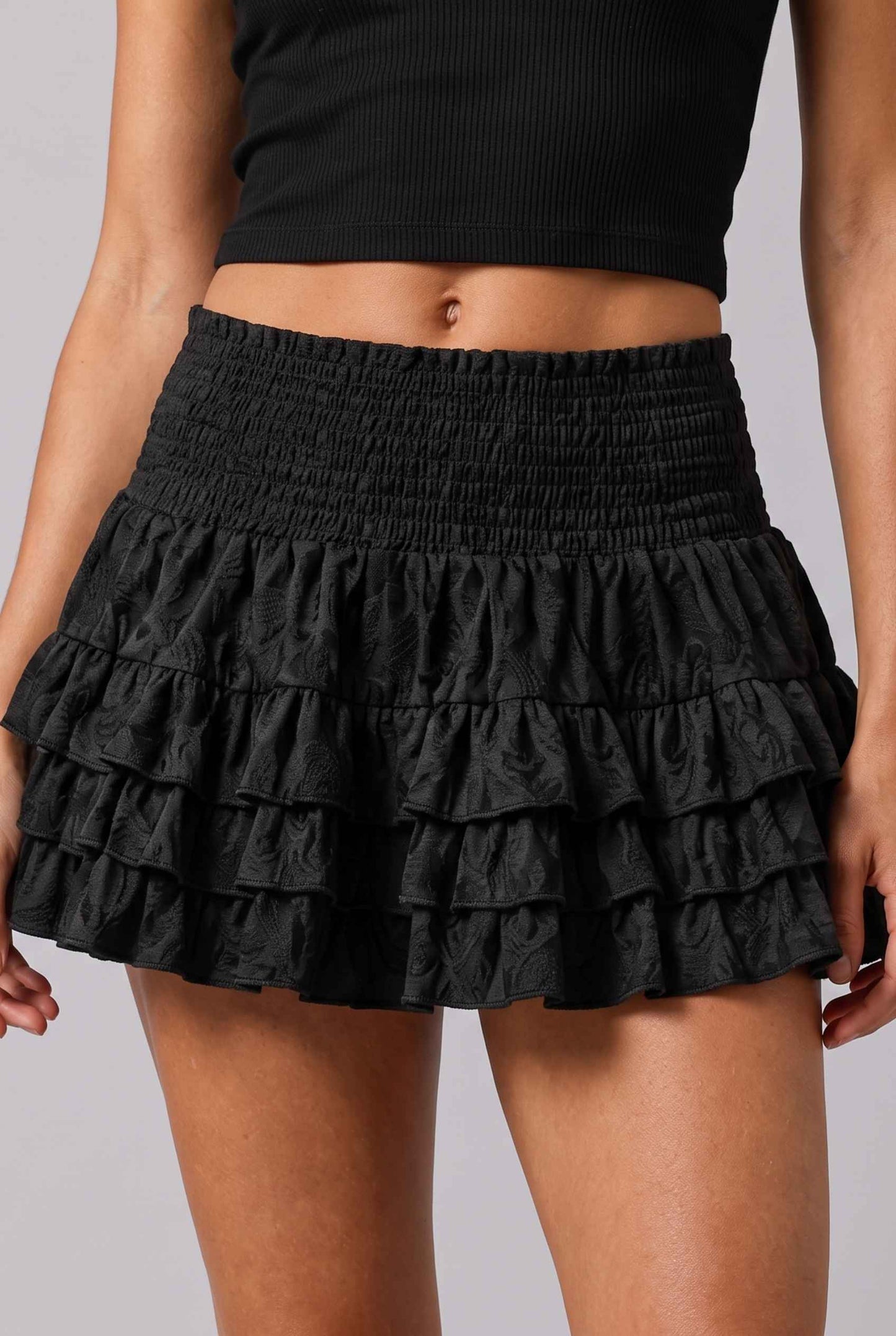 Virtual Model wearing The Etta Tiered Ruffle Mini Skirt Black Smocked Ruffle Layered Mini Skirt