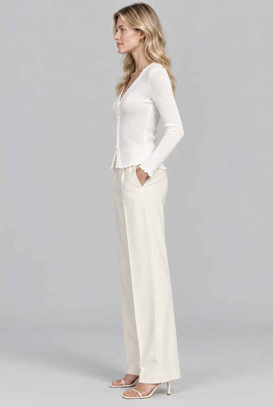 Virtual model wearing The Joli Pearl-Button Cardigan Lettuce-Edge Ruffle-Trim Cardigan in White