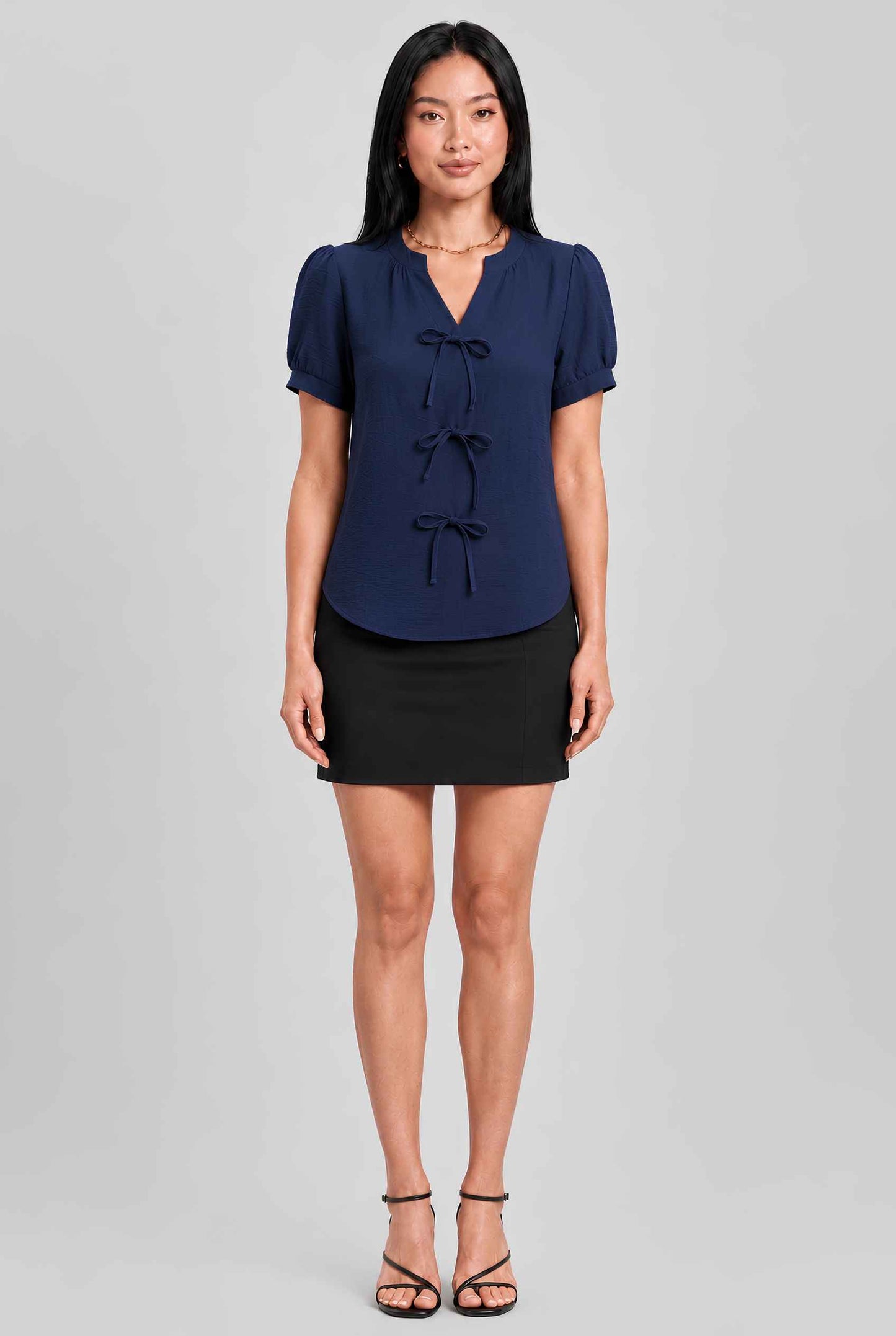 Virtual model wearing The Lillian Bow Blouse Puff Sleeve Bow Triple Detail Crepe Blouse in Navy