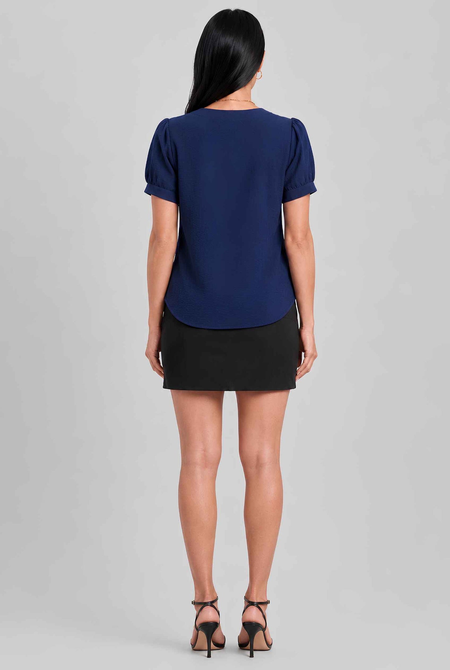 Virtual model wearing The Lillian Bow Blouse Puff Sleeve Bow Triple Detail Crepe Blouse in Navy