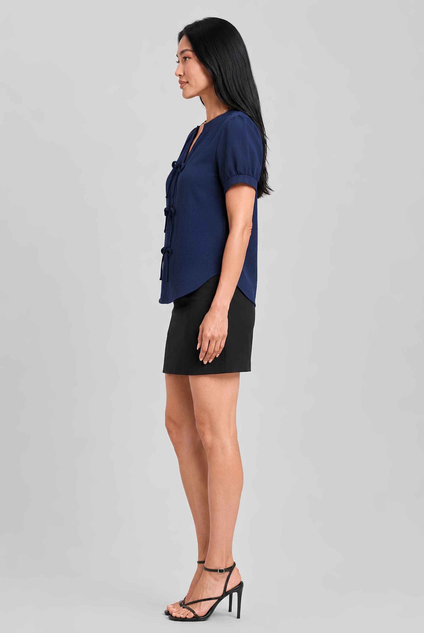 Virtual model wearing The Lillian Bow Blouse Puff Sleeve Bow Triple Detail Crepe Blouse in Navy
