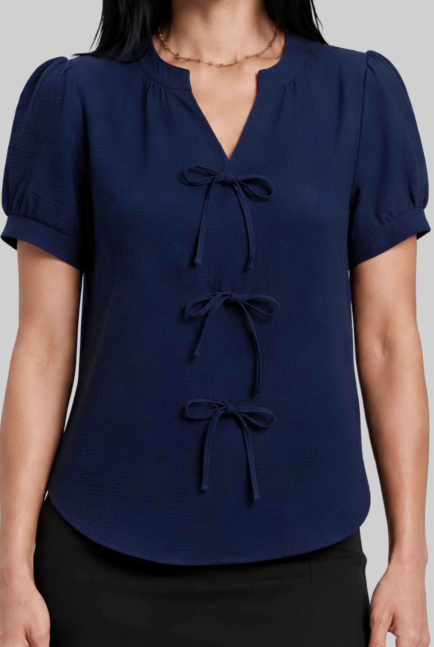 Virtual model wearing The Lillian Bow Blouse Puff Sleeve Bow Triple Detail Crepe Blouse in Navy