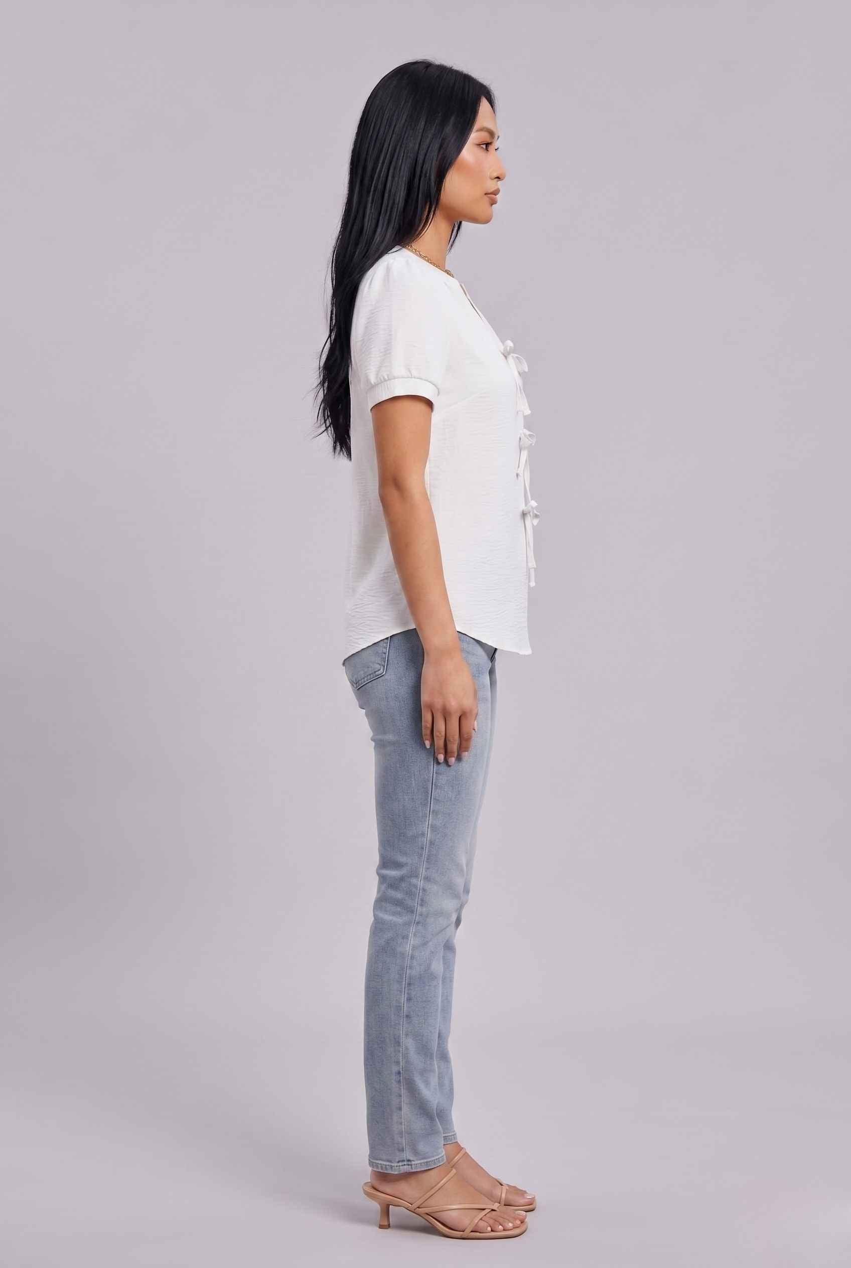 Virtual Model wearing The Lillian Bow Blouse Puff Sleeve Off White Crepe Top