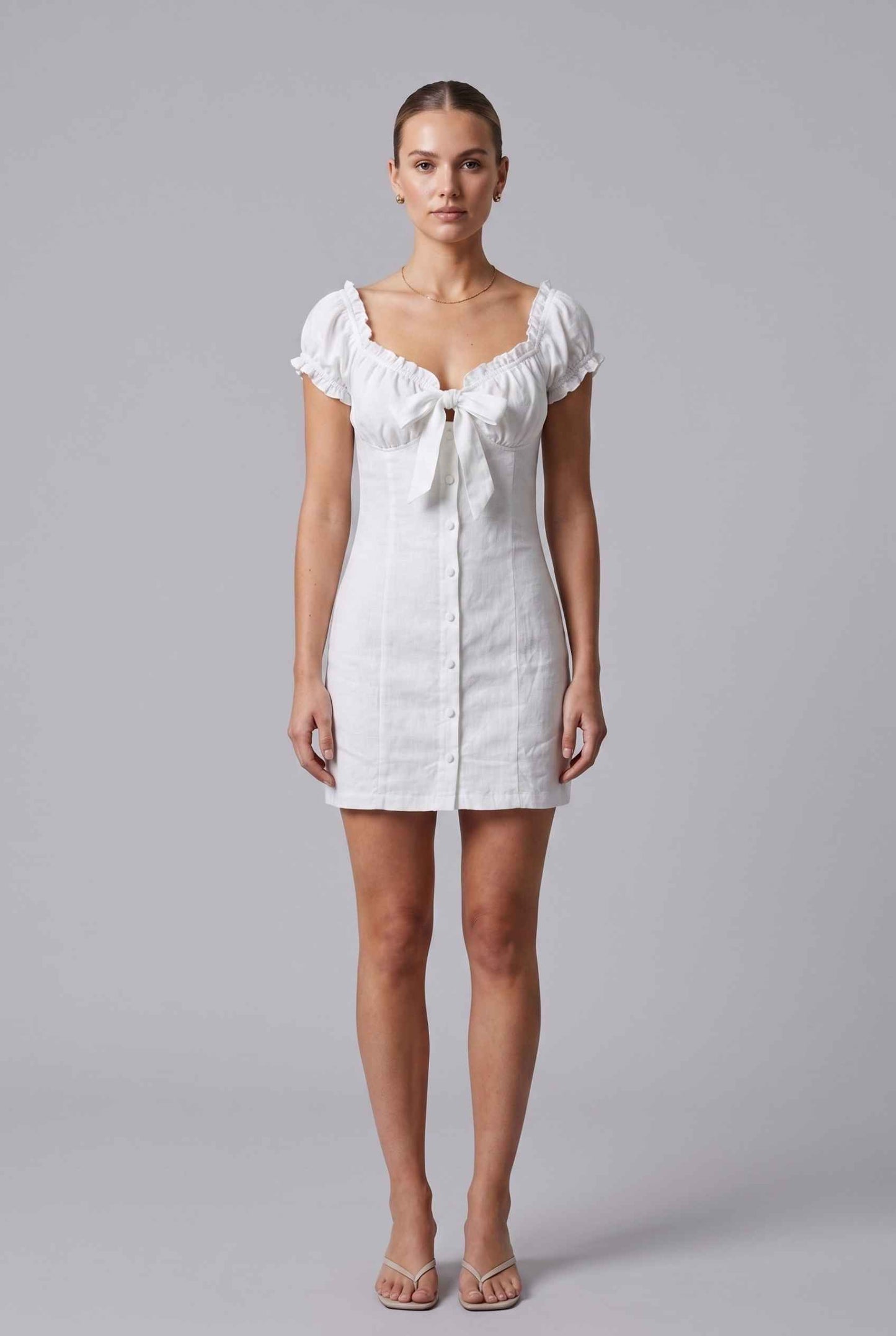 Virtual Model wearing The Lily Buttoned Mini Milkmaid Puff Sleeve White Mini Dress