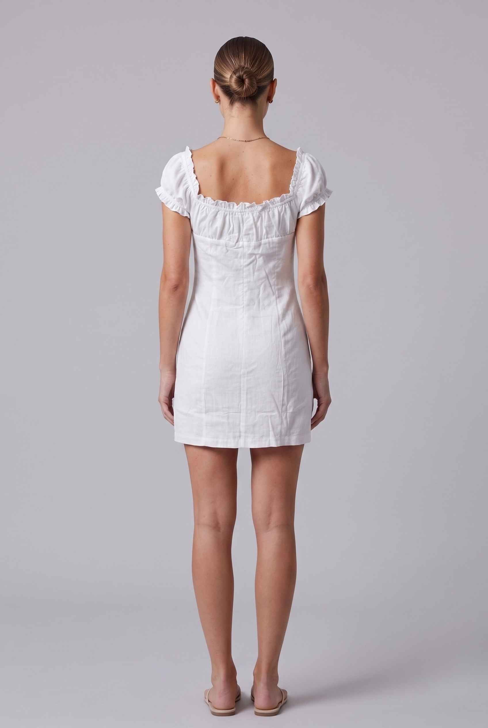 Virtual Model wearing The Lily Buttoned Mini Milkmaid Puff Sleeve White Mini Dress