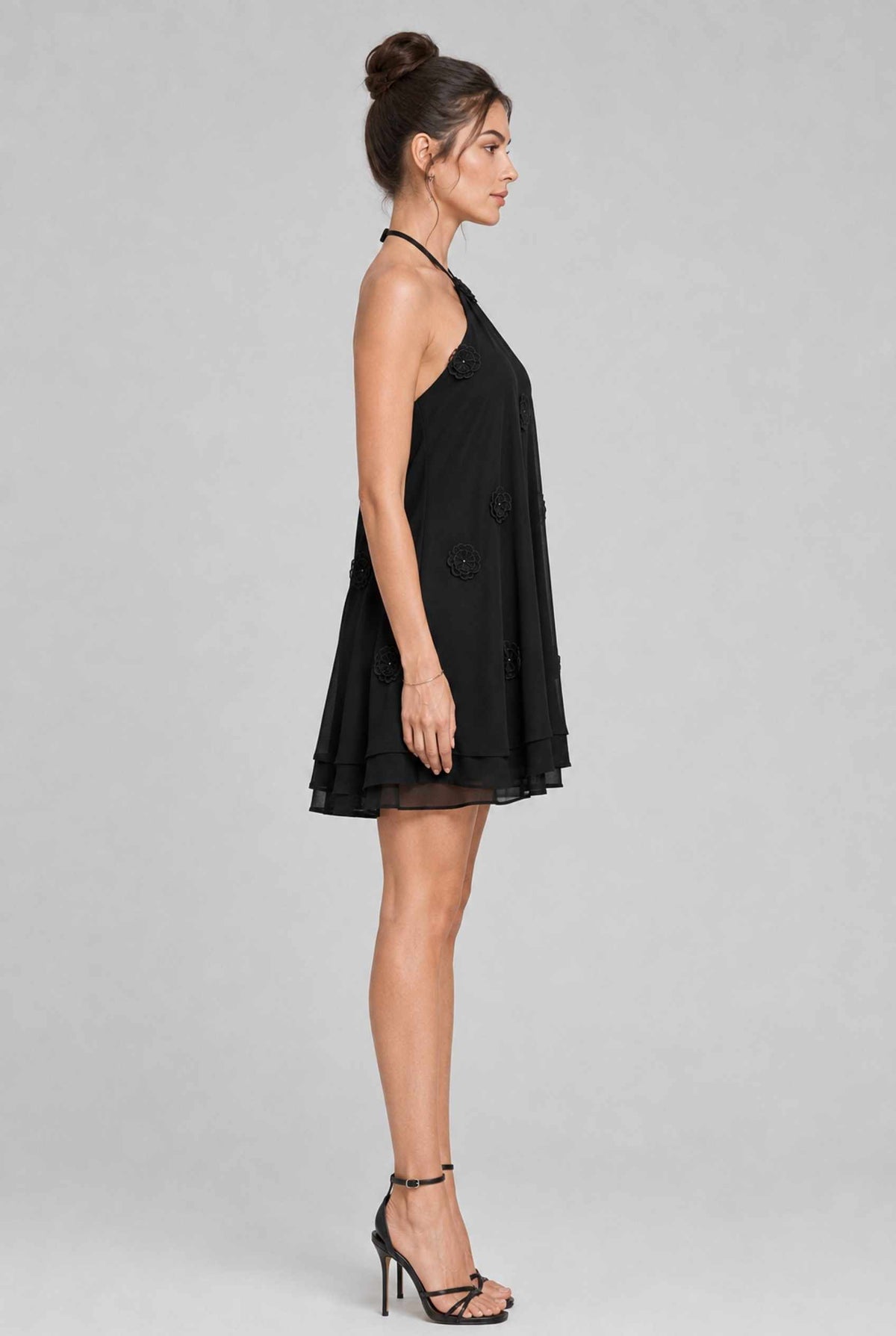 Virtual model wearing The Marbella Chiffon Halter Mini Dress Floral Appliqué Mini Dress in Black