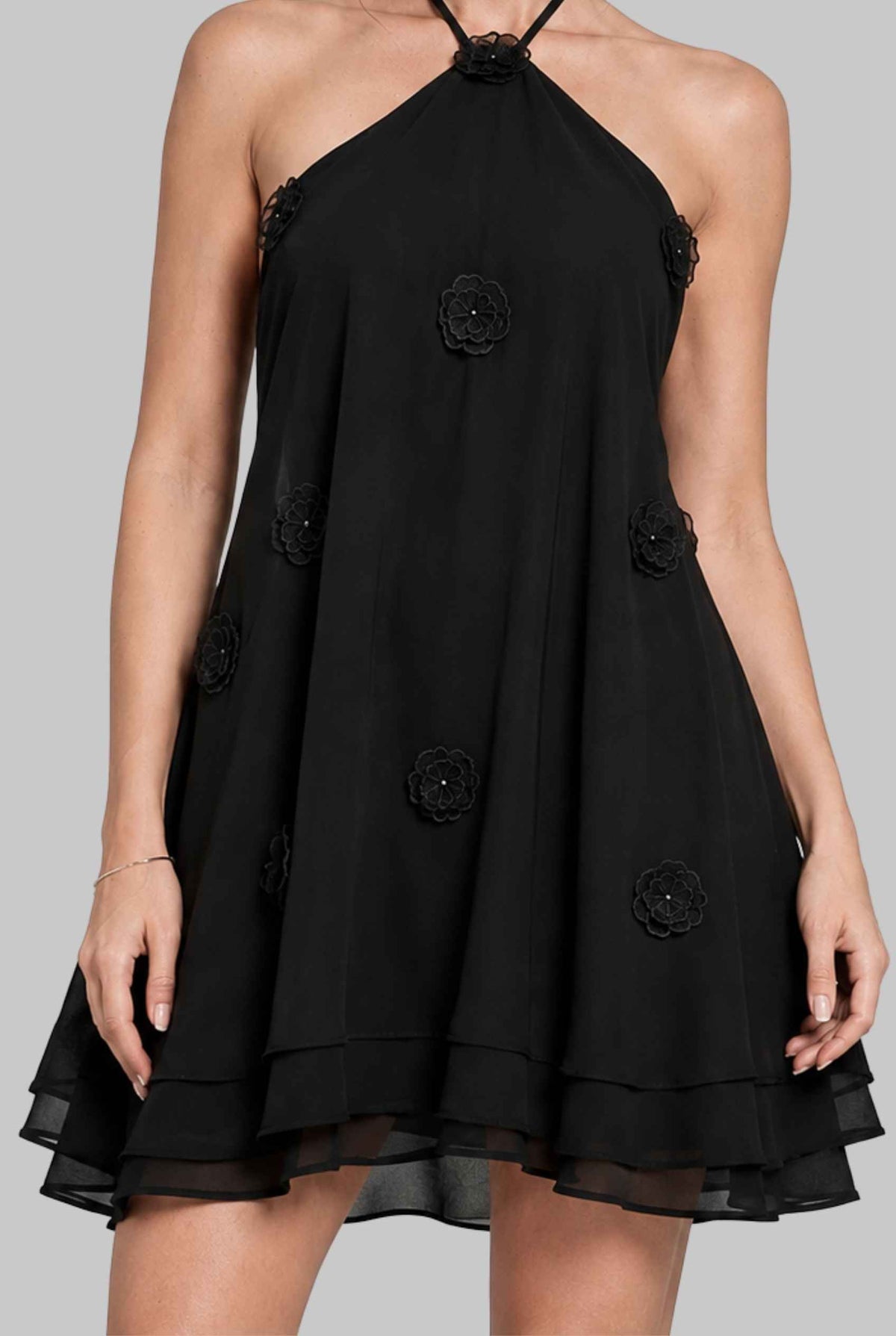 Virtual model wearing The Marbella Chiffon Halter Mini Dress Floral Appliqué Mini Dress in Black