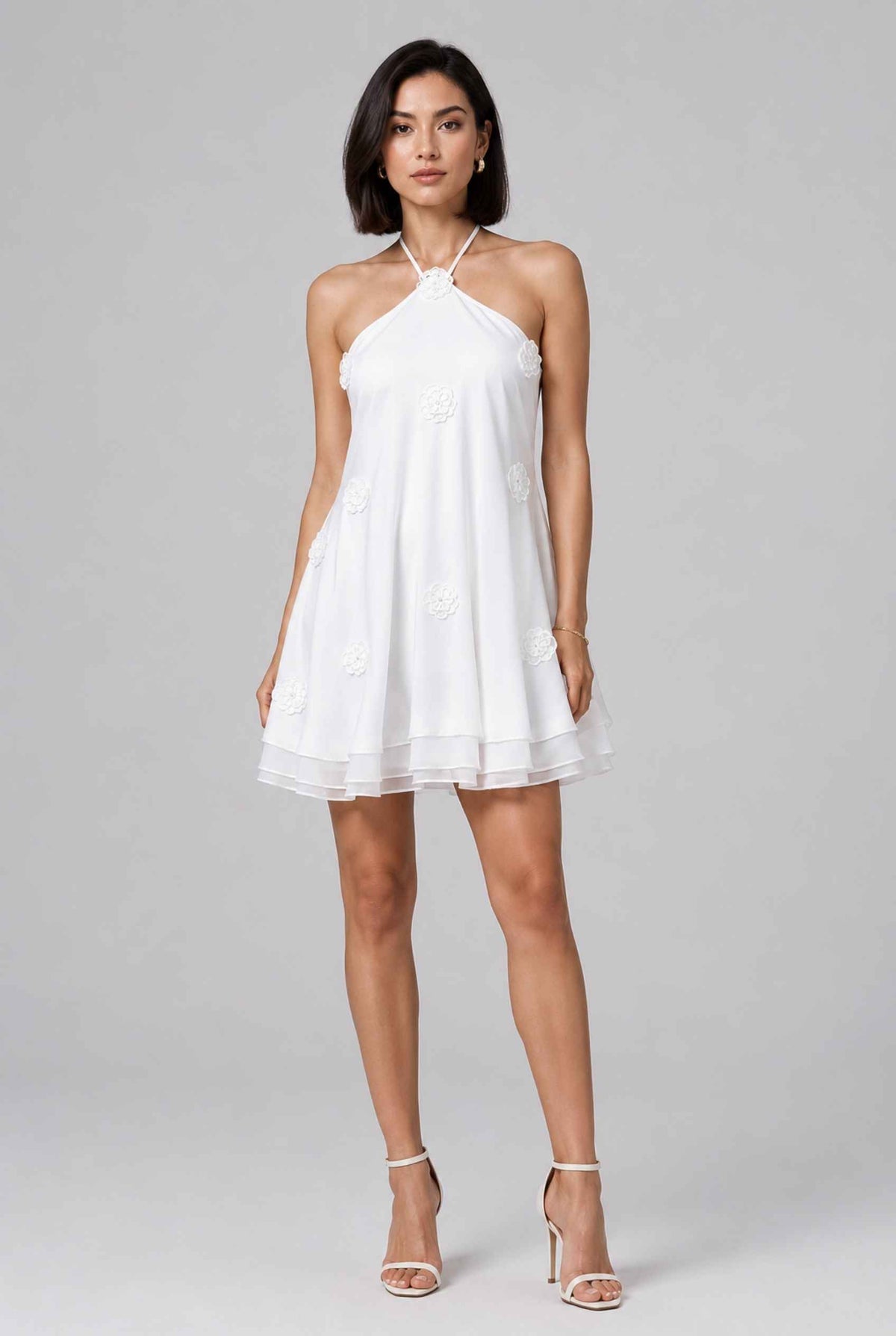 Virtual model wearing The Marbella Chiffon Halter Mini Dress Floral Appliqué Mini Dress in White