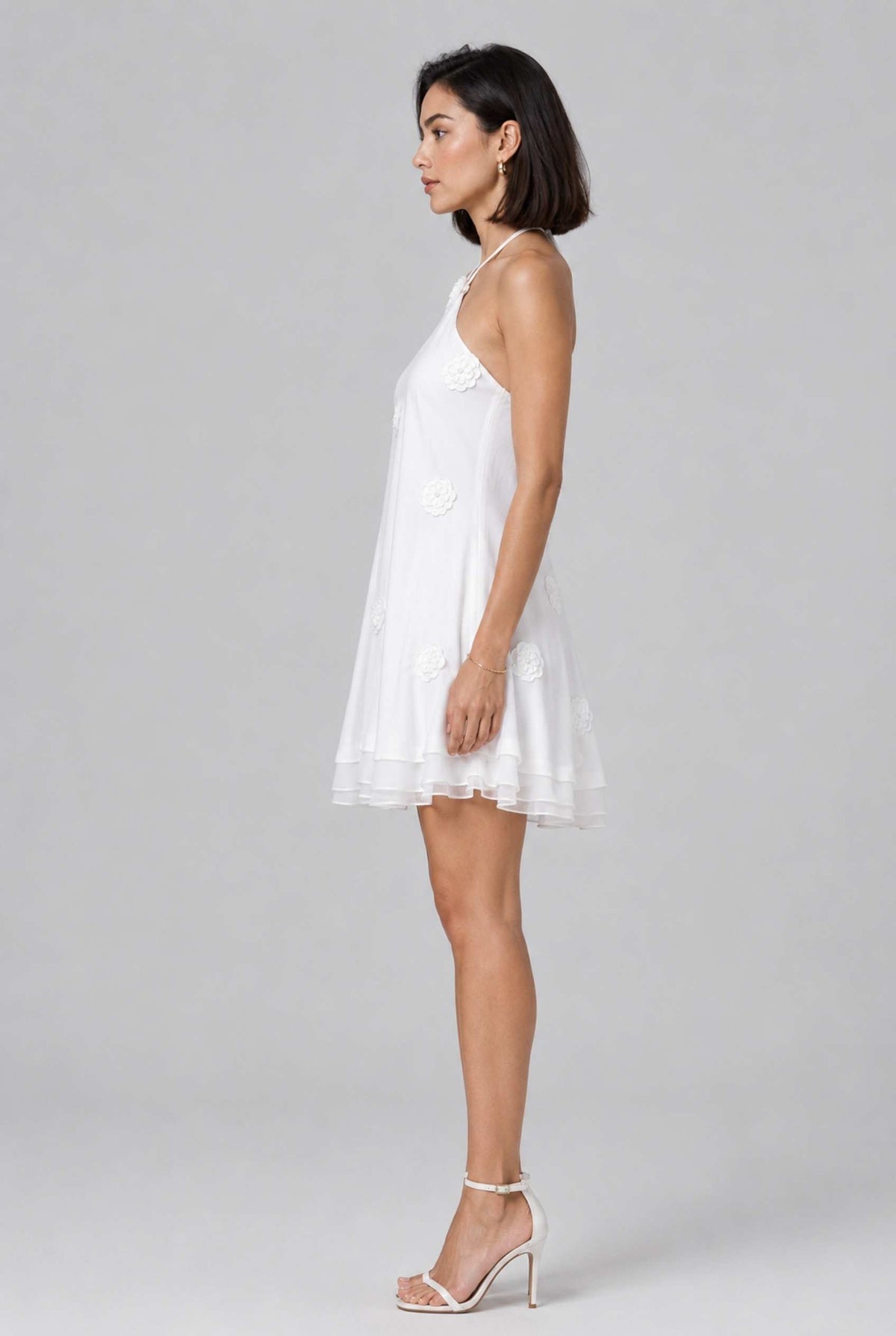 Virtual model wearing The Marbella Chiffon Halter Mini Dress Floral Appliqué Mini Dress in White