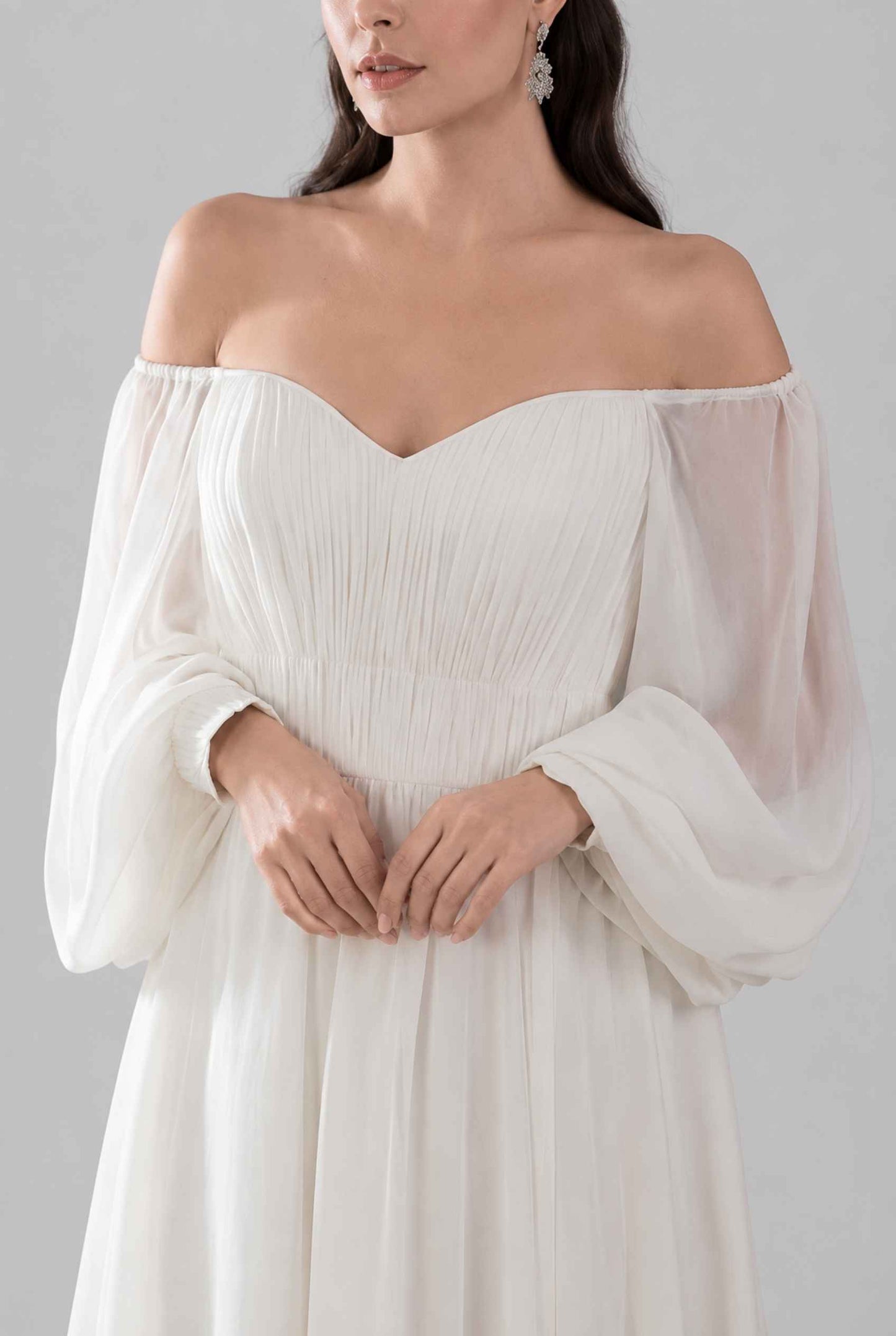 Virtual model wearing The Margaux Pleated Chiffon Dress Off-Shoulder Bishop-Sleeve Gown in White
