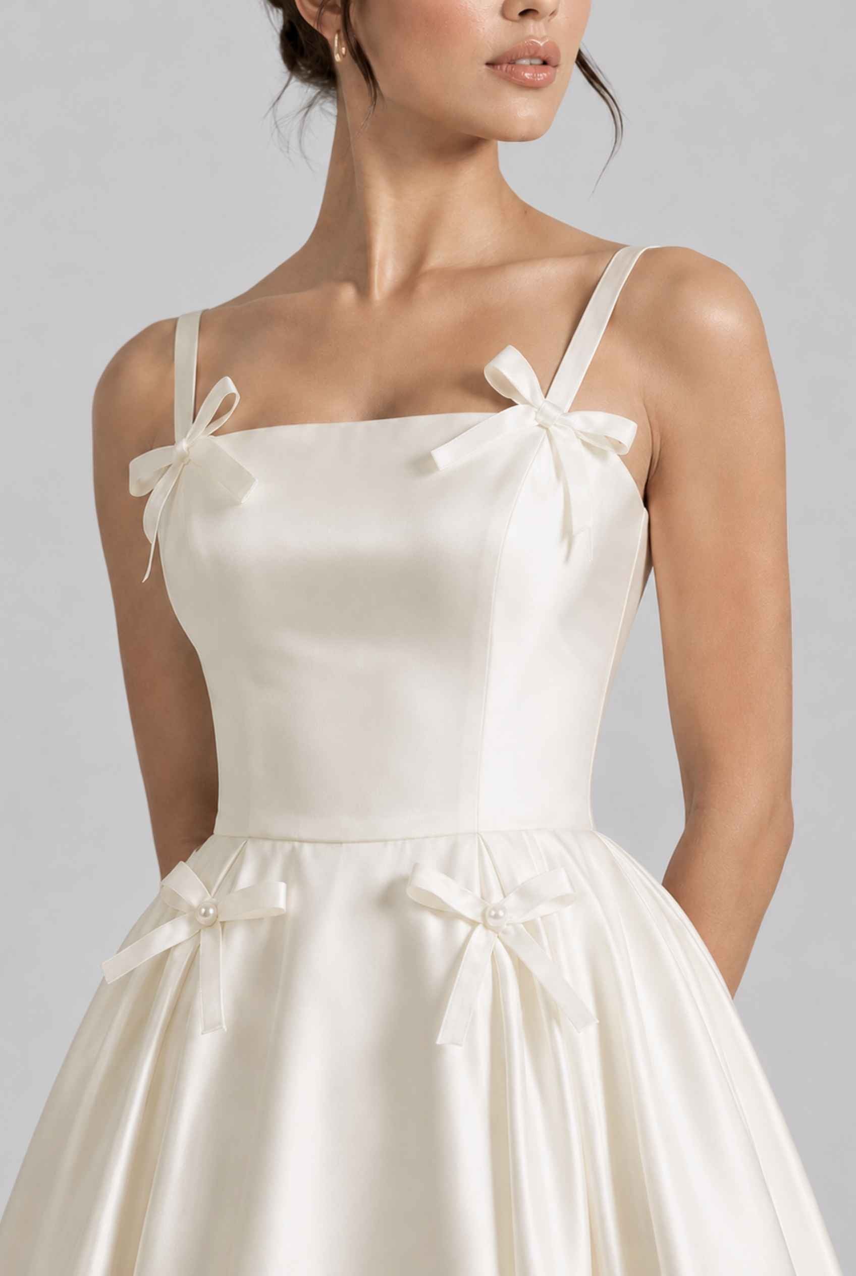 Virtual model wearing The Mariposa Bow Satin Dress Ivory Satin Bow A-Line Gown