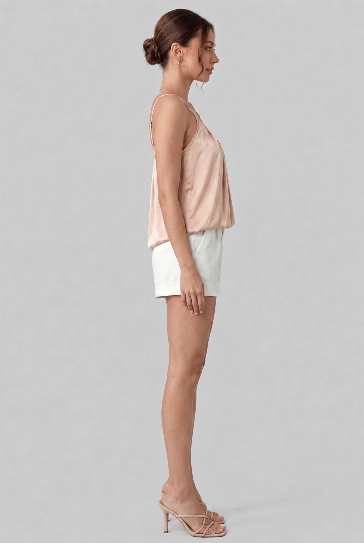 Virtual model wearing The Maya Swing Camisole Pleated Scoop Neck Swing Tank Top in Beige