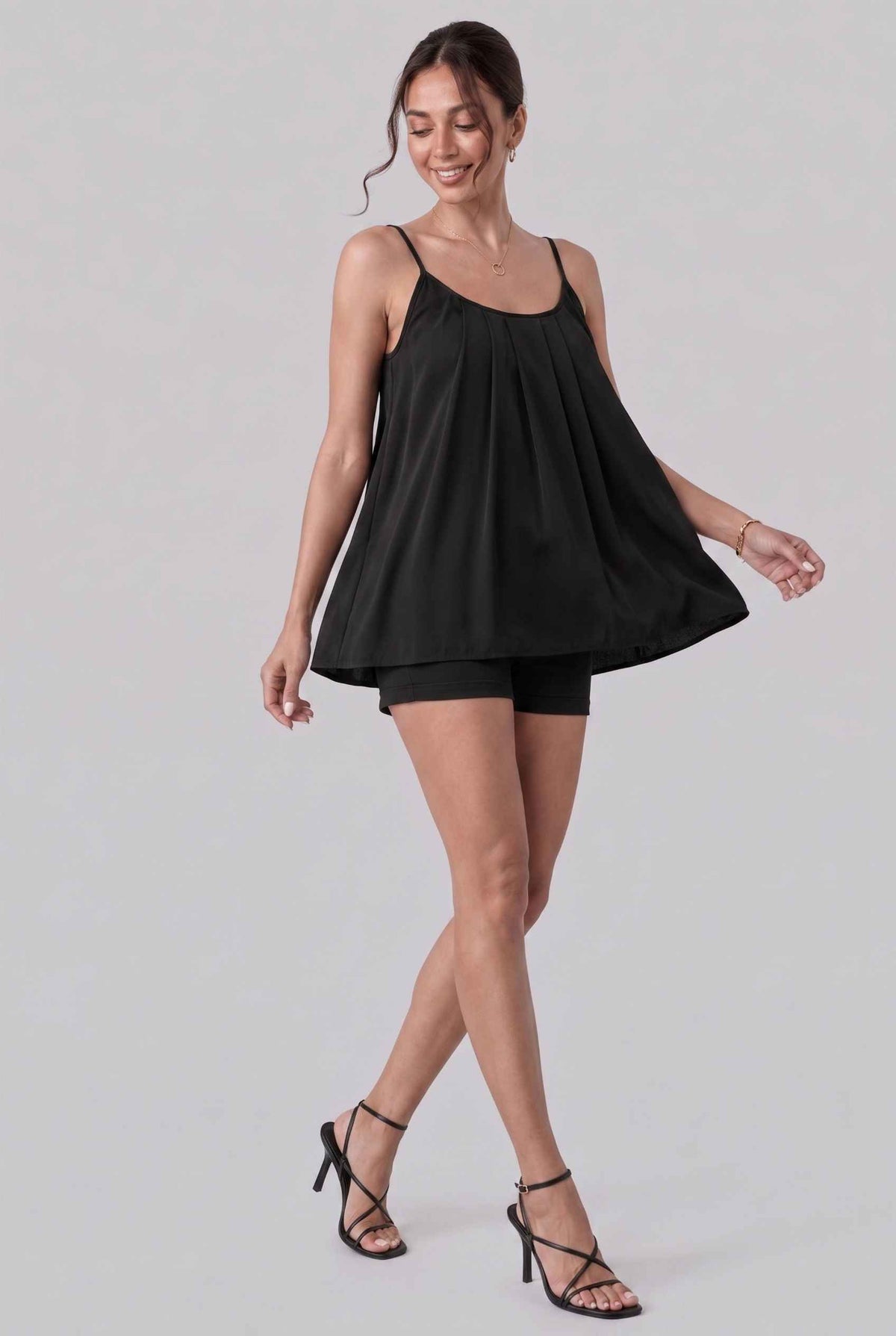 Virtual model wearing The Maya Swing Camisole Pleated Scoop Neck Swing Tank Top in Black