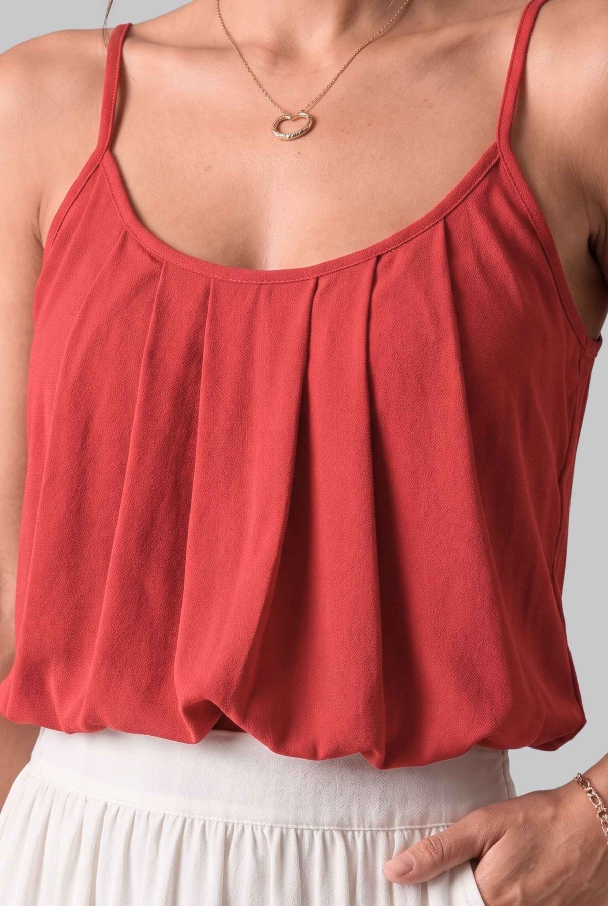 Virtual model wearing The Maya Swing Camisole Pleated Scoop Neck Swing Tank Top in Red
