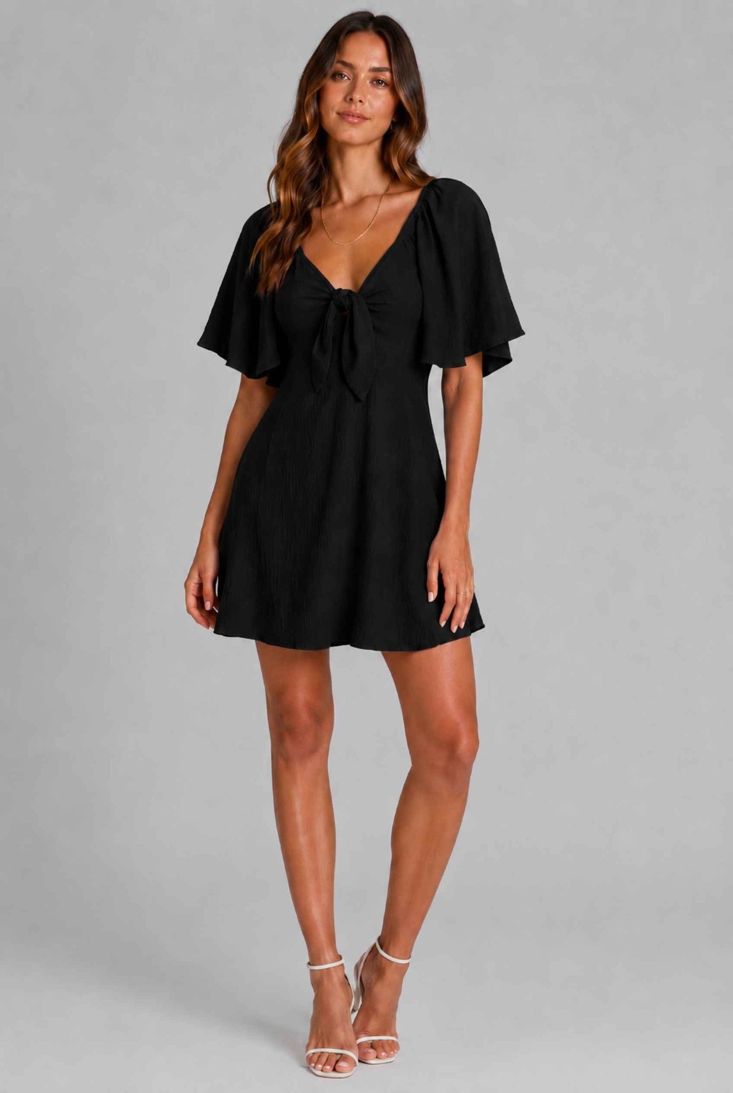Virtual Model wearing The Melody Flutter Sleeve Mini Tie-Front Flutter-Sleeve Black Mini Dress