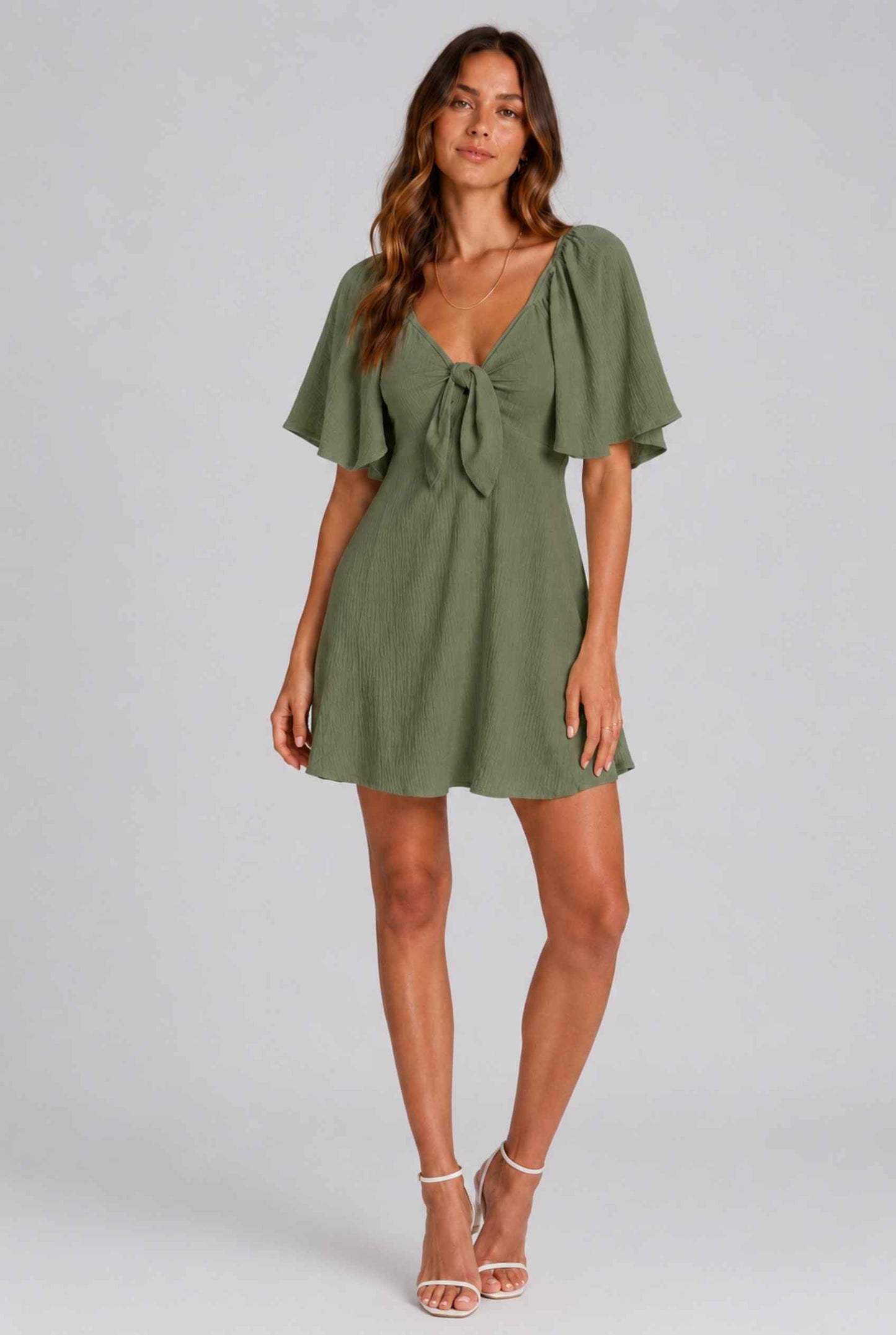 Virtual Model wearing The Melody Flutter Sleeve Mini Tie-Front Flutter-Sleeve Dark Green Mini Dress