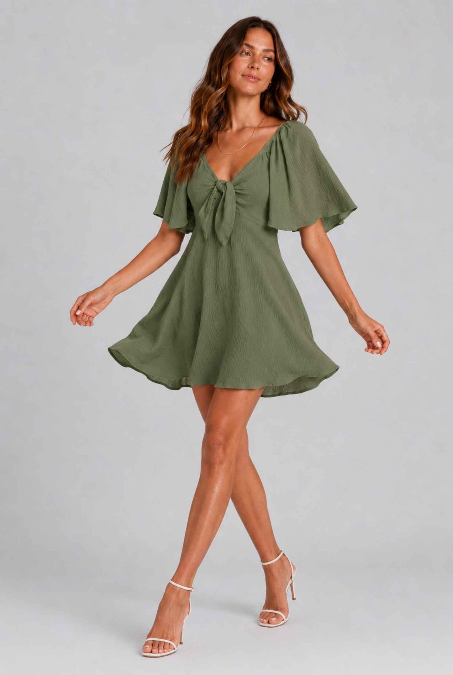 Virtual Model wearing The Melody Flutter Sleeve Mini Tie-Front Flutter-Sleeve Dark Green Mini Dress