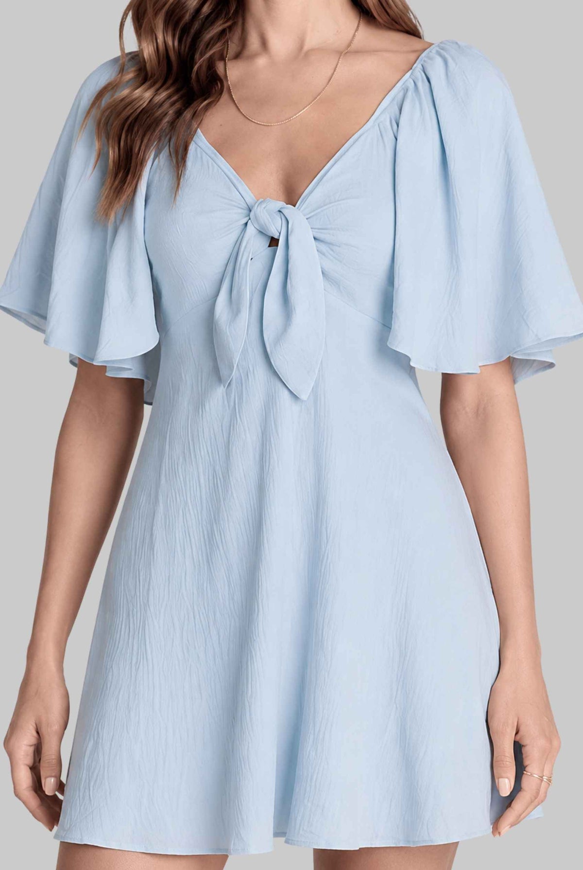 Virtual model wearing The Melody Flutter Sleeve Mini Tie-Front Flutter-Sleeve Mini Dress in Light Blue