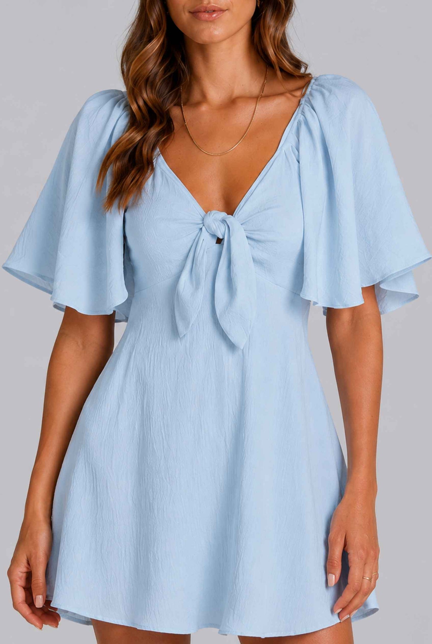 Virtual Model wearing The Melody Flutter Sleeve Mini Tie-Front Flutter-Sleeve Light Blue Mini Dress