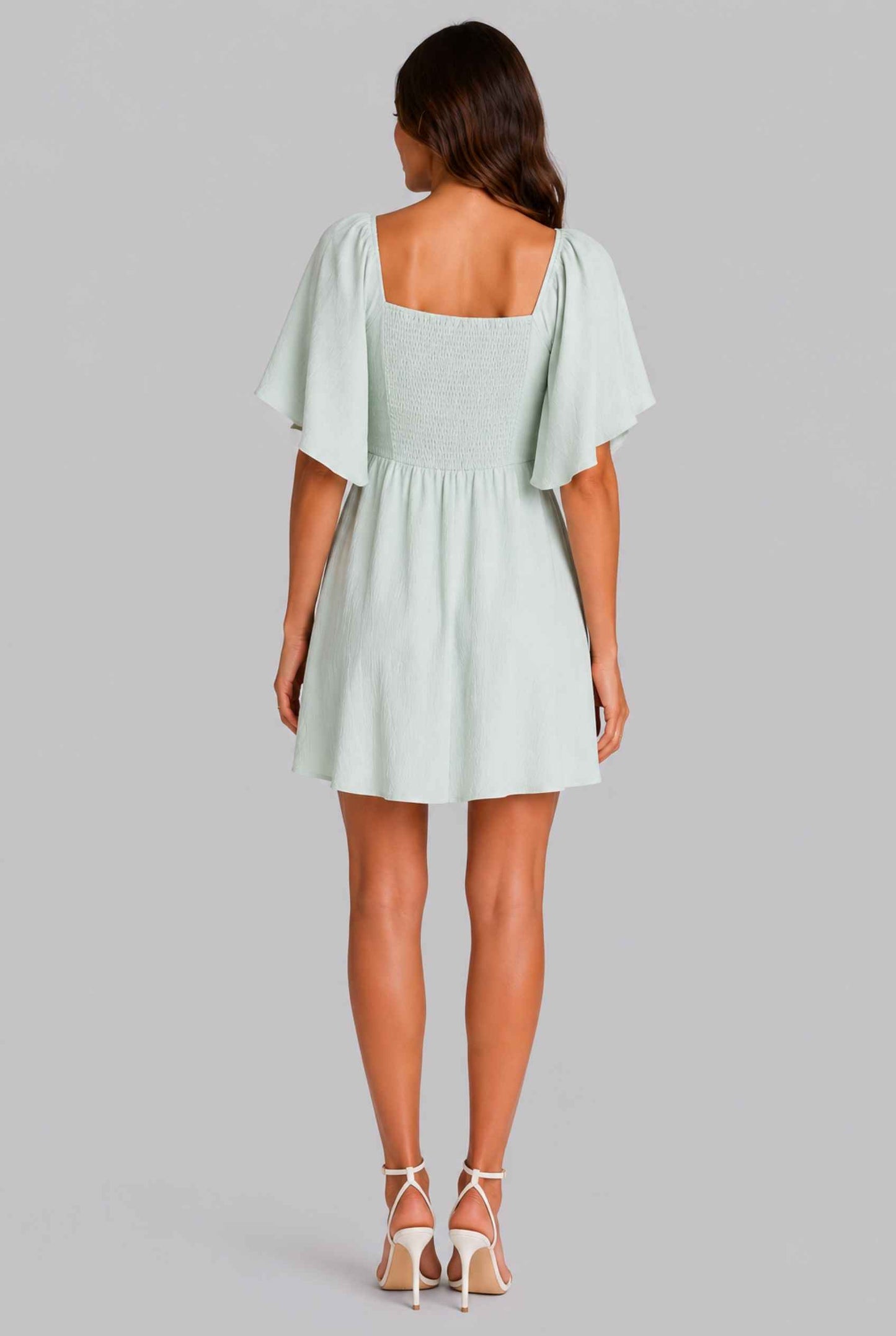 Virtual Model wearing The Melody Flutter Sleeve Mini Tie-Front Flutter-Sleeve Light Green Mini Dress