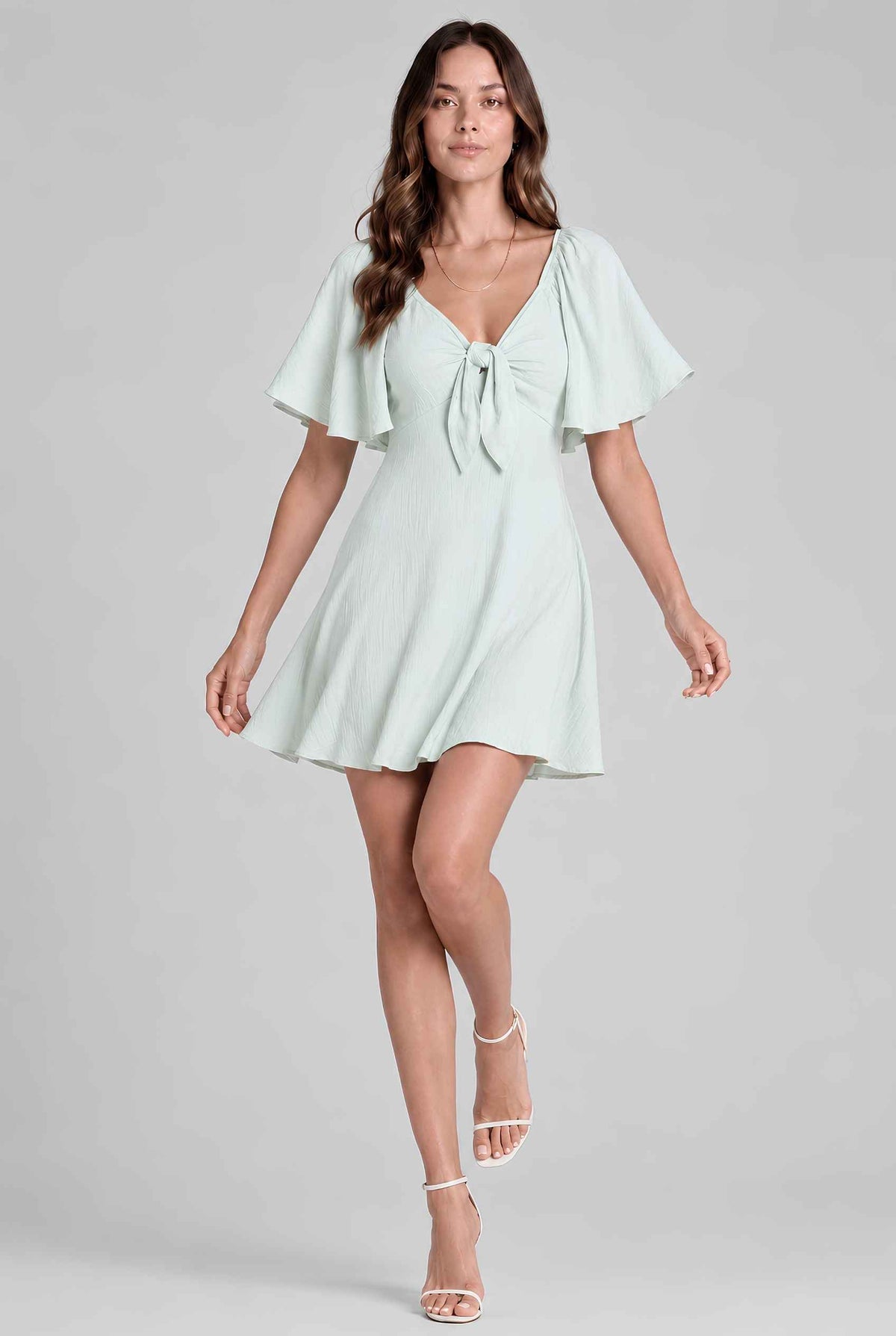 Virtual model wearing The Melody Flutter Sleeve Mini Tie-Front Flutter-Sleeve Mini Dress in Light Green