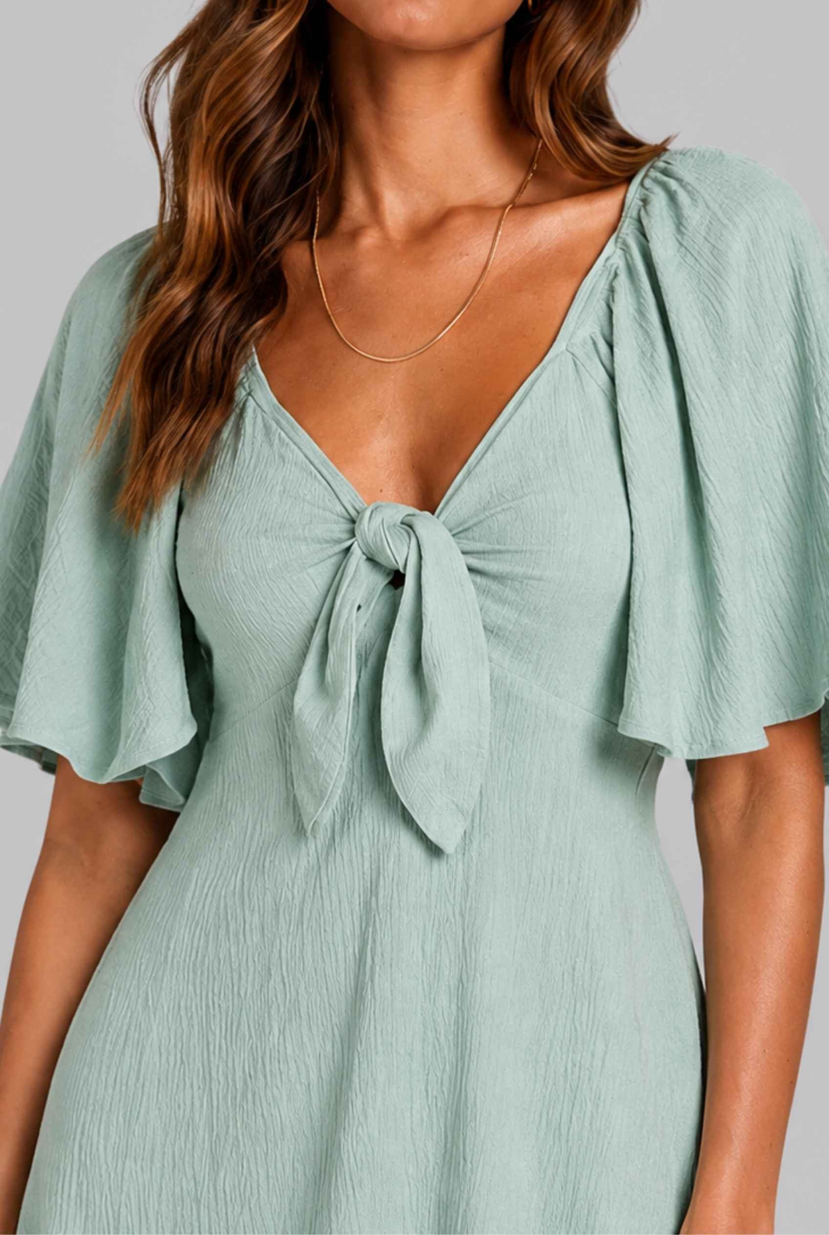 Virtual Model wearing The Melody Flutter Sleeve Mini Tie-Front Flutter-Sleeve Mint Mini Dress