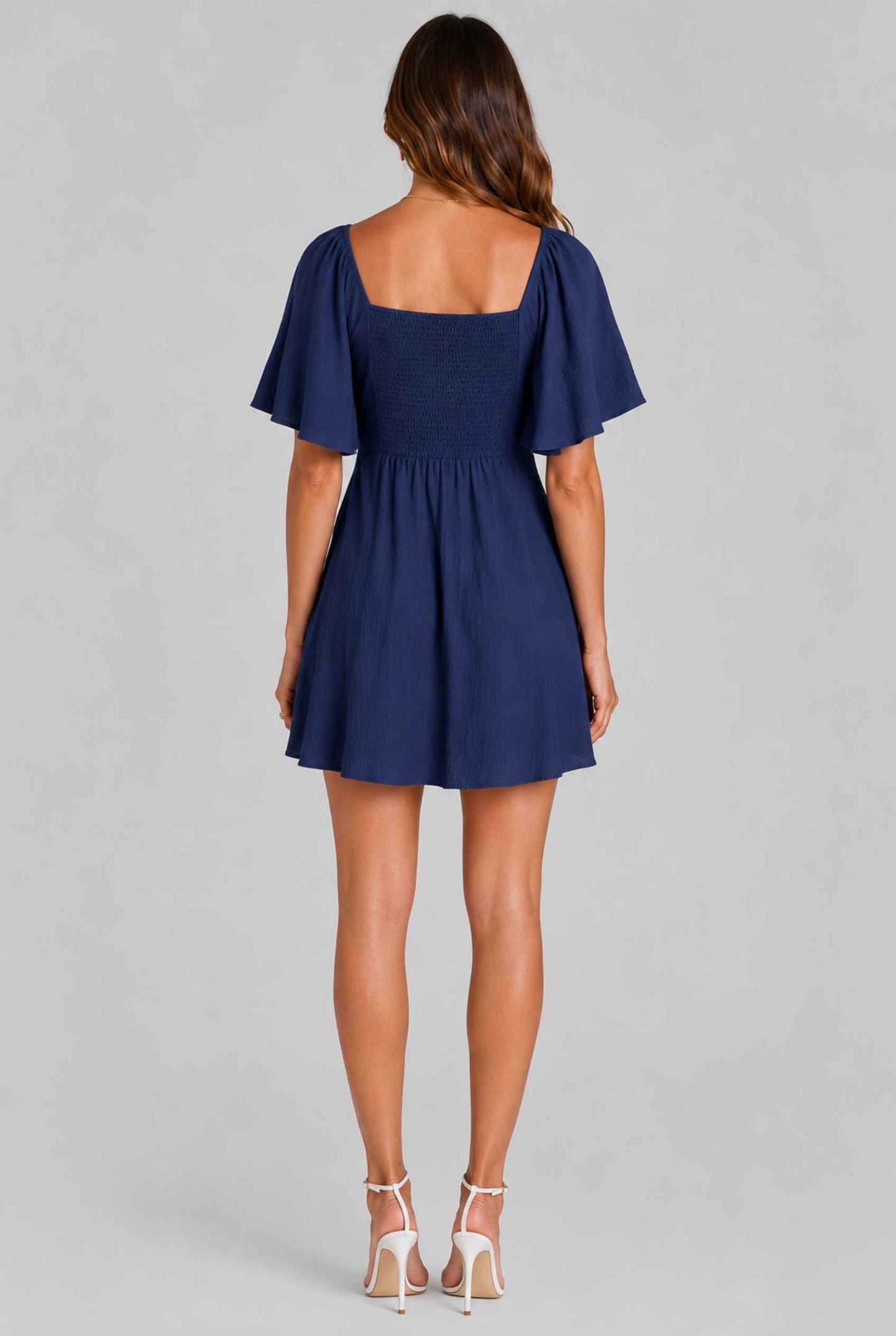 Virtual Model wearing The Melody Flutter Sleeve Mini Tie-Front Flutter-Sleeve Navy Mini Dress