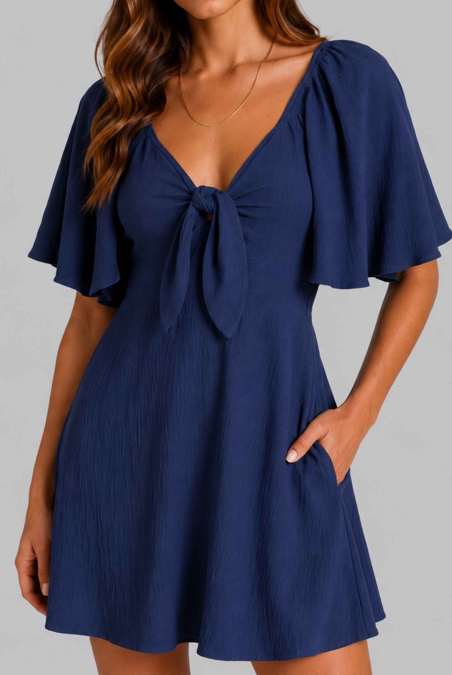Virtual Model wearing The Melody Flutter Sleeve Mini Tie-Front Flutter-Sleeve Navy Mini Dress