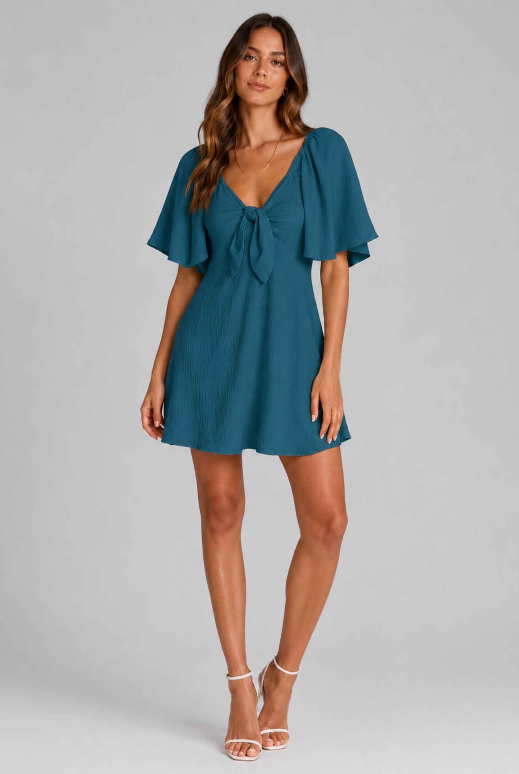 Virtual Model wearing The Melody Flutter Sleeve Mini Tie-Front Flutter-Sleeve Teal Mini Dress