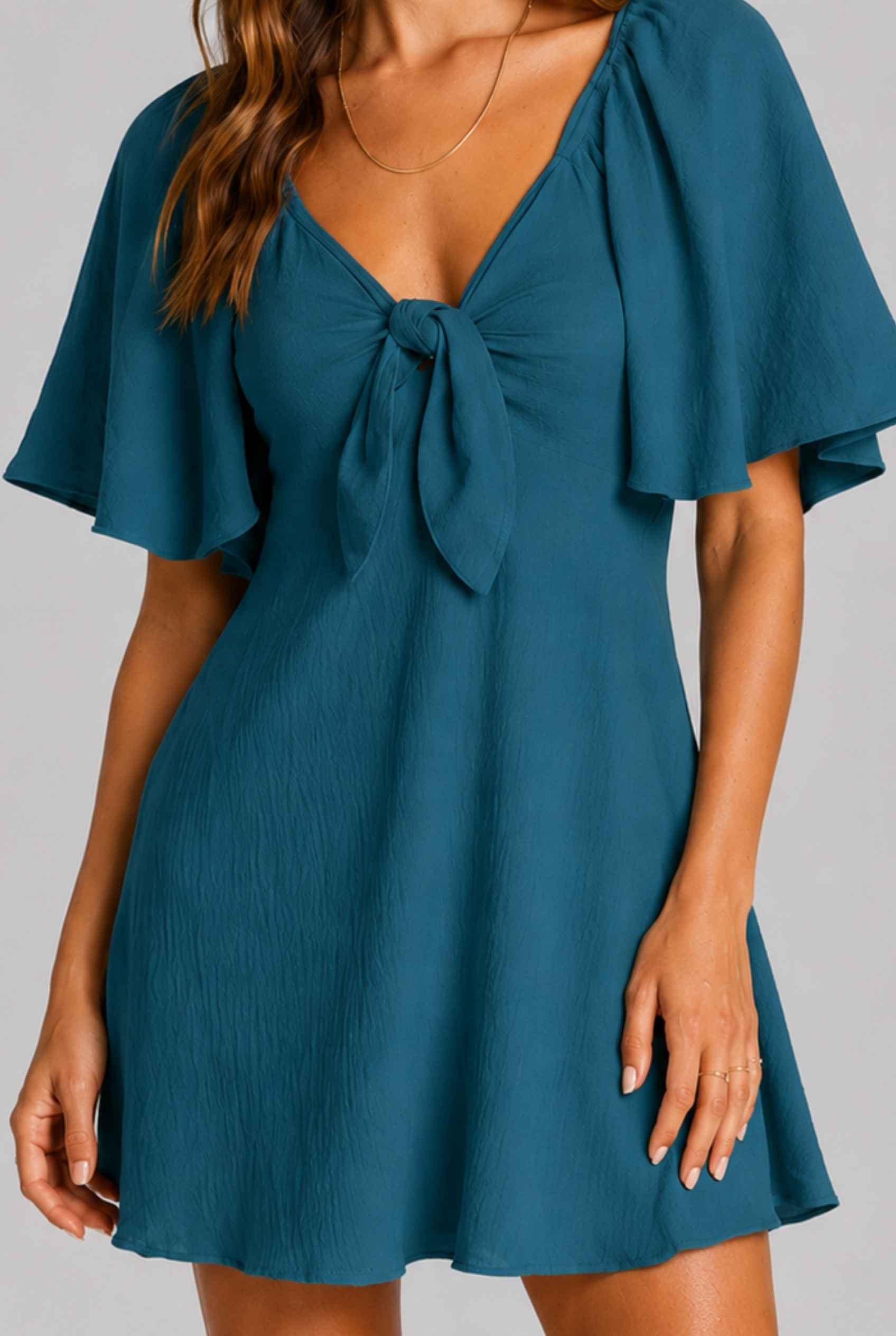 Virtual Model wearing The Melody Flutter Sleeve Mini Tie-Front Flutter-Sleeve Teal Mini Dress