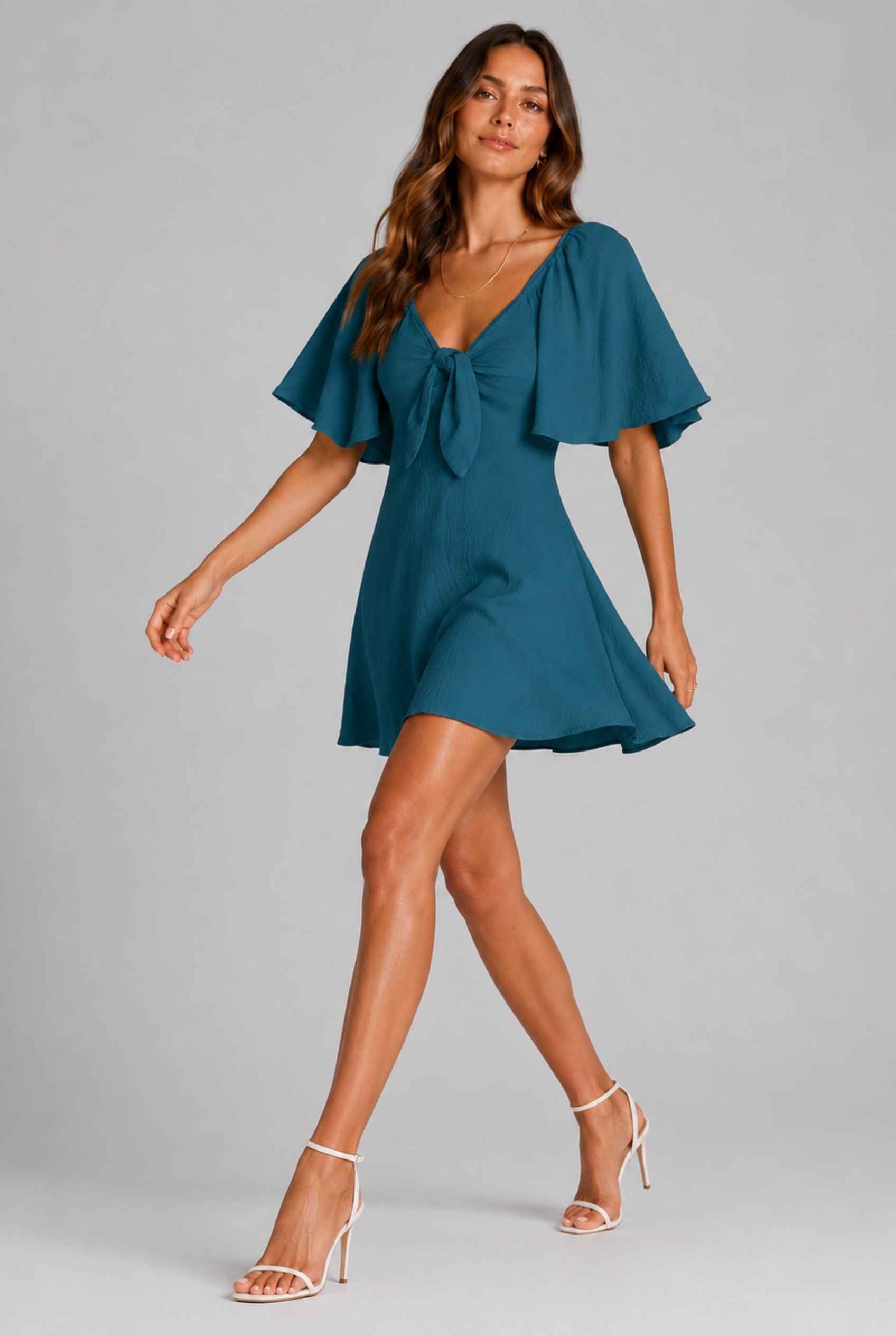 Virtual Model wearing The Melody Flutter Sleeve Mini Tie-Front Flutter-Sleeve Teal Mini Dress
