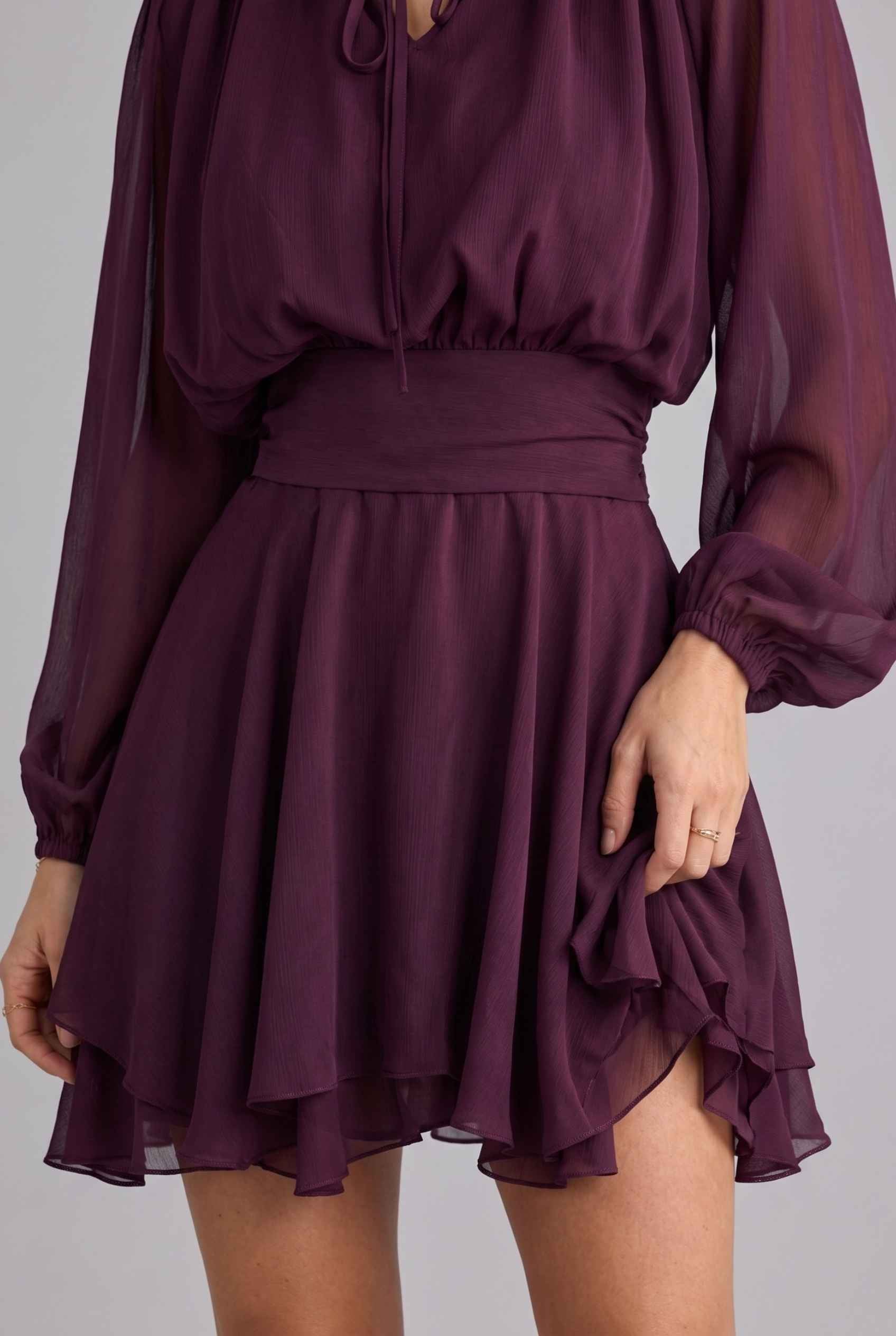 Virtual model wearing The Mirabel Chiffon Dress Purple Layered Tie-Up Bishop Sleeve Mini Dress