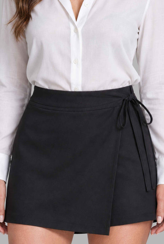 Virtual model wearing The Mykonos Side-Tie Skort Asymmetrical Wrap Skort in Black