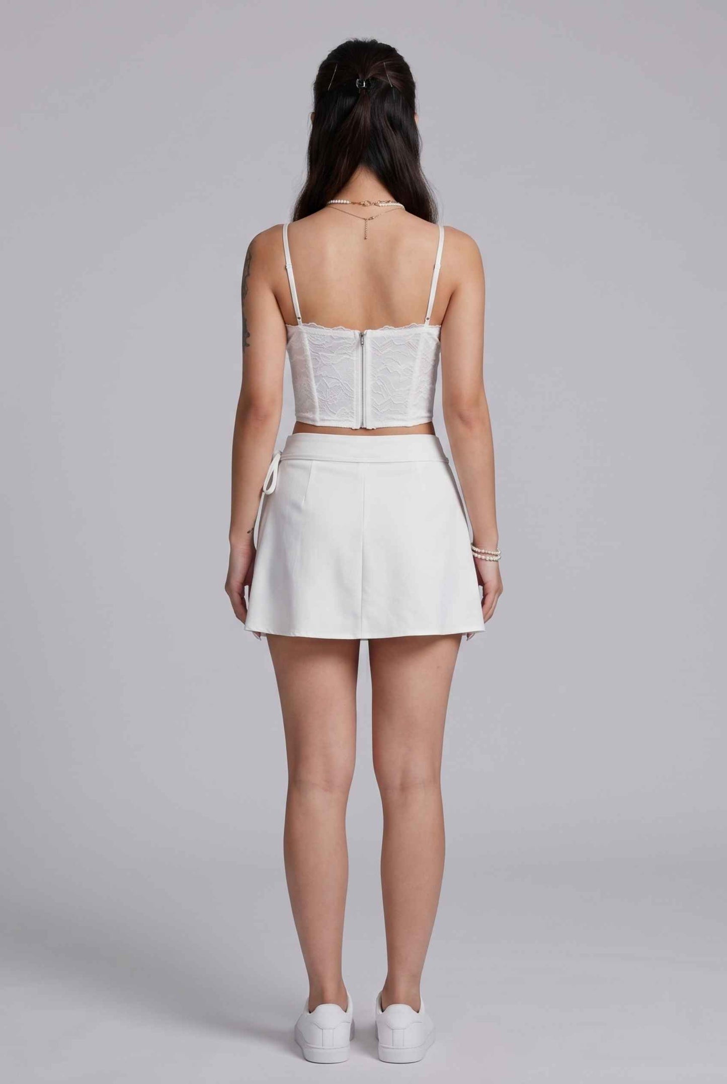 Virtual Model wearing The Mykonos Side-Tie Skort Asymmetrical White Wrap Skort
