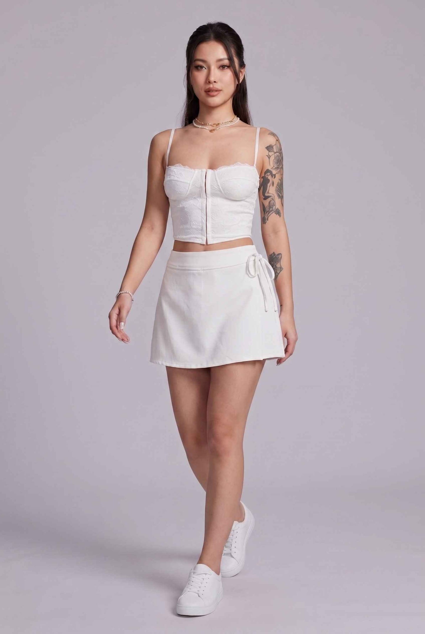 Virtual Model wearing The Mykonos Side-Tie Skort Asymmetrical White Wrap Skort