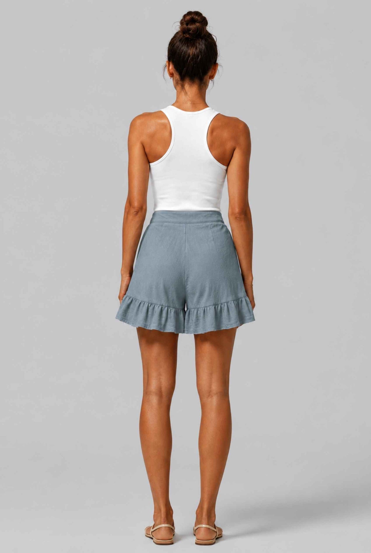 Virtual Model Wearing The Nerina Ruffle Short Blue High-Waisted Wide-Leg Ruffle Hem Shorts
