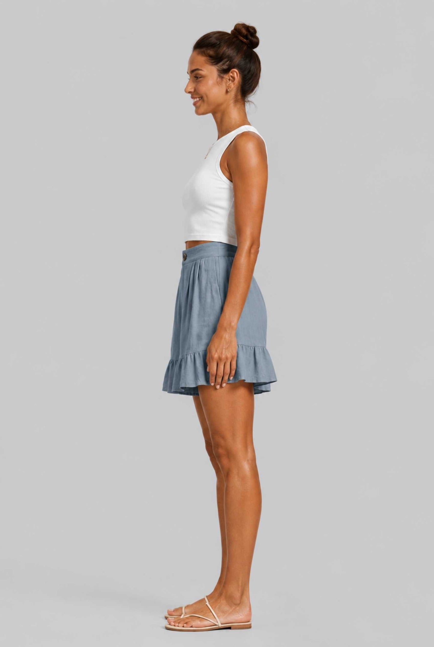 Virtual Model Wearing The Nerina Ruffle Short Blue High-Waisted Wide-Leg Ruffle Hem Shorts