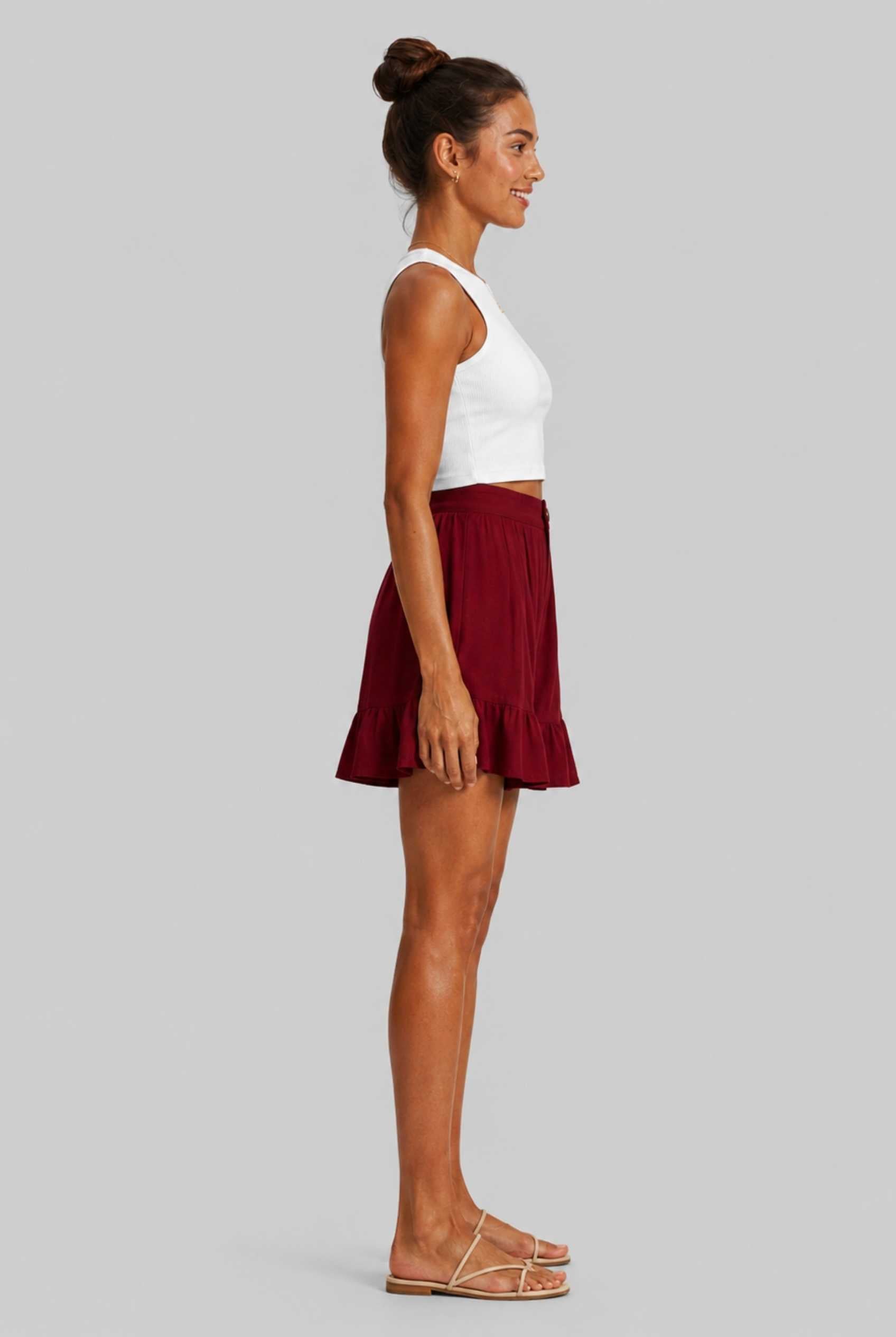 Virtual Model Wearing The Nerina Ruffle Short Burgundy High-Waisted Wide-Leg Ruffle Hem Shorts